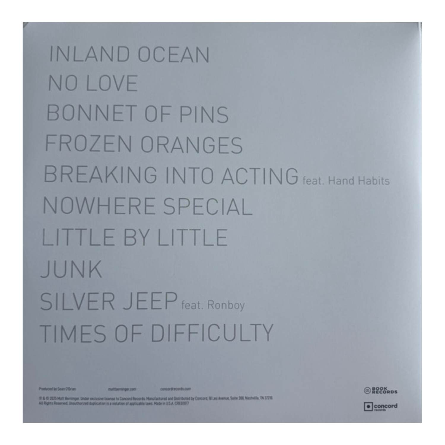 Liste des titres de l'album sur fond gris. Les titres incluent 'Inland Ocean', 'No Love', 'Bonnet of Pins', 'Frozen Oranges', 'Silver Jeep'.