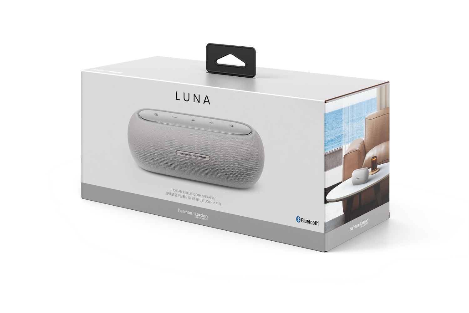 Una caja que muestra un altavoz Harman Kardon Luna. La caja tiene una imagen del altavoz y la palabra Luna. Un asa negra en la parte superior.