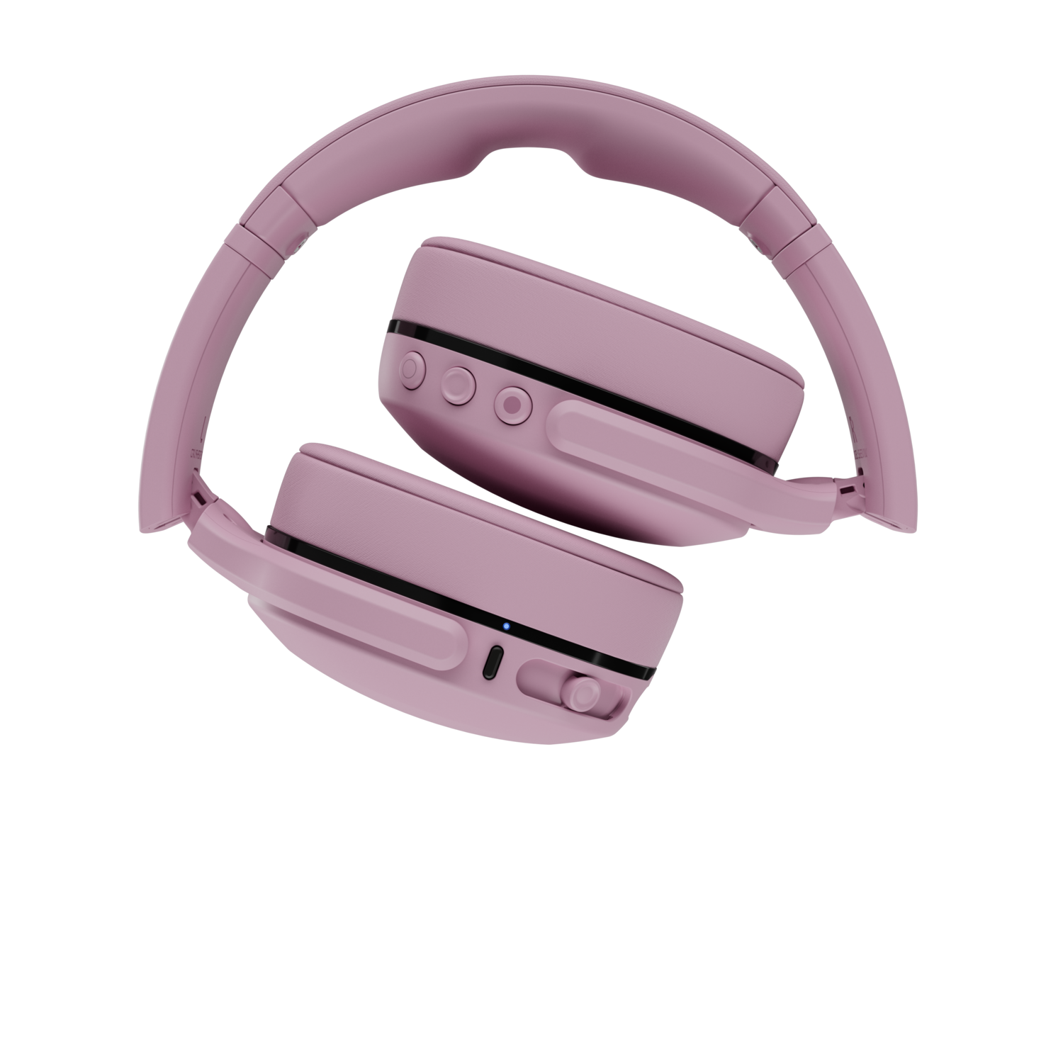 Casque rose sur fond noir. Le casque est plié, montrant les écouteurs et le bandeau.