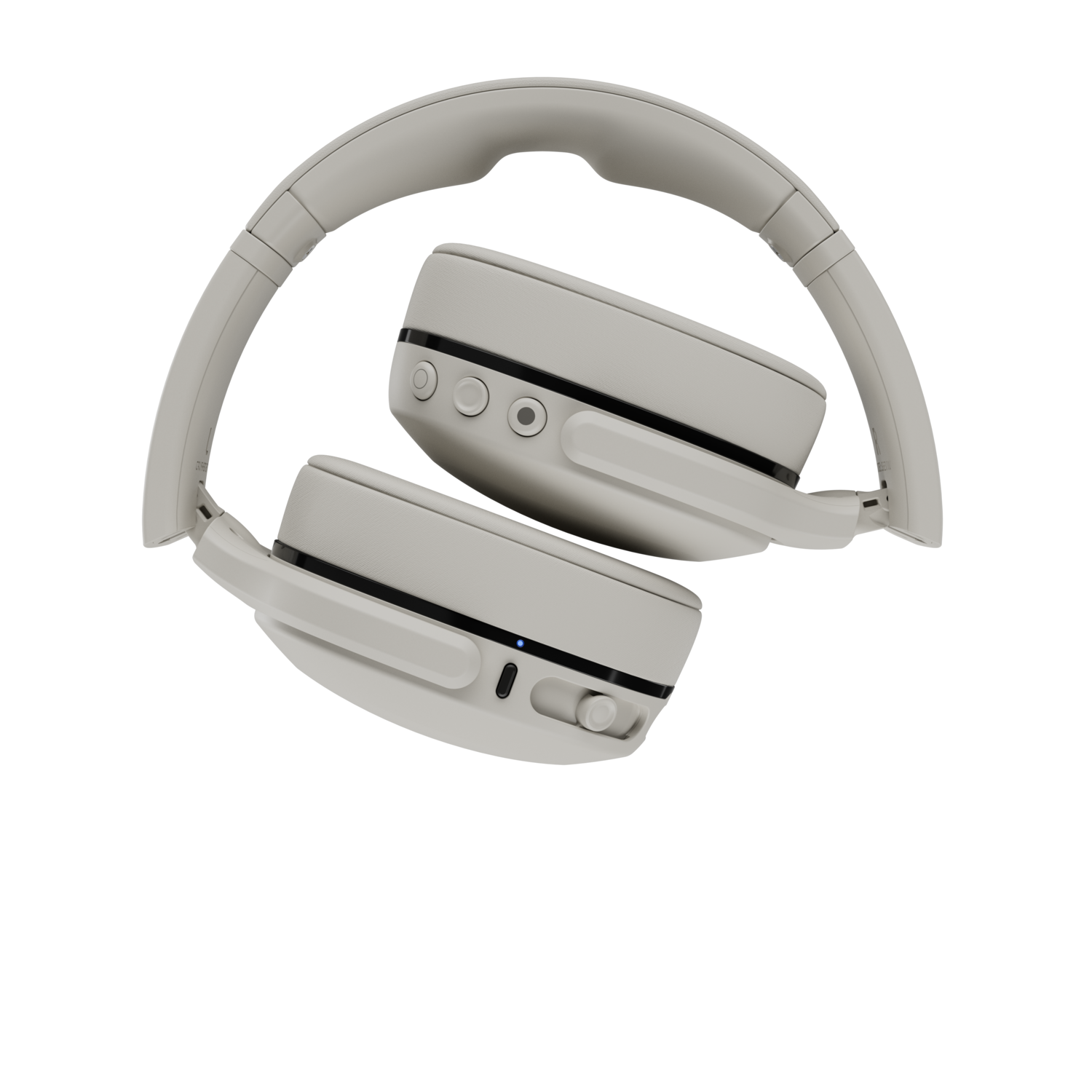 Casque audio blanc cassé sur fond noir. Le casque est plié, montrant les écouteurs et l'arceau.