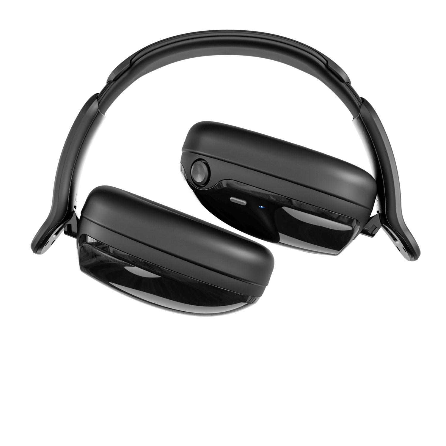 Casque noir sur fond noir. Le casque est incliné, montrant les écouteurs et le bandeau.