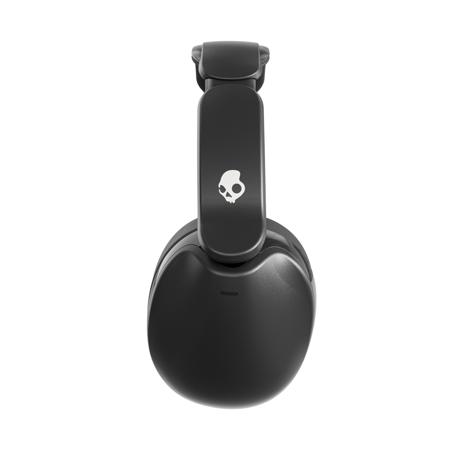 Casque Skullcandy noir sur fond noir. Le casque est plié.