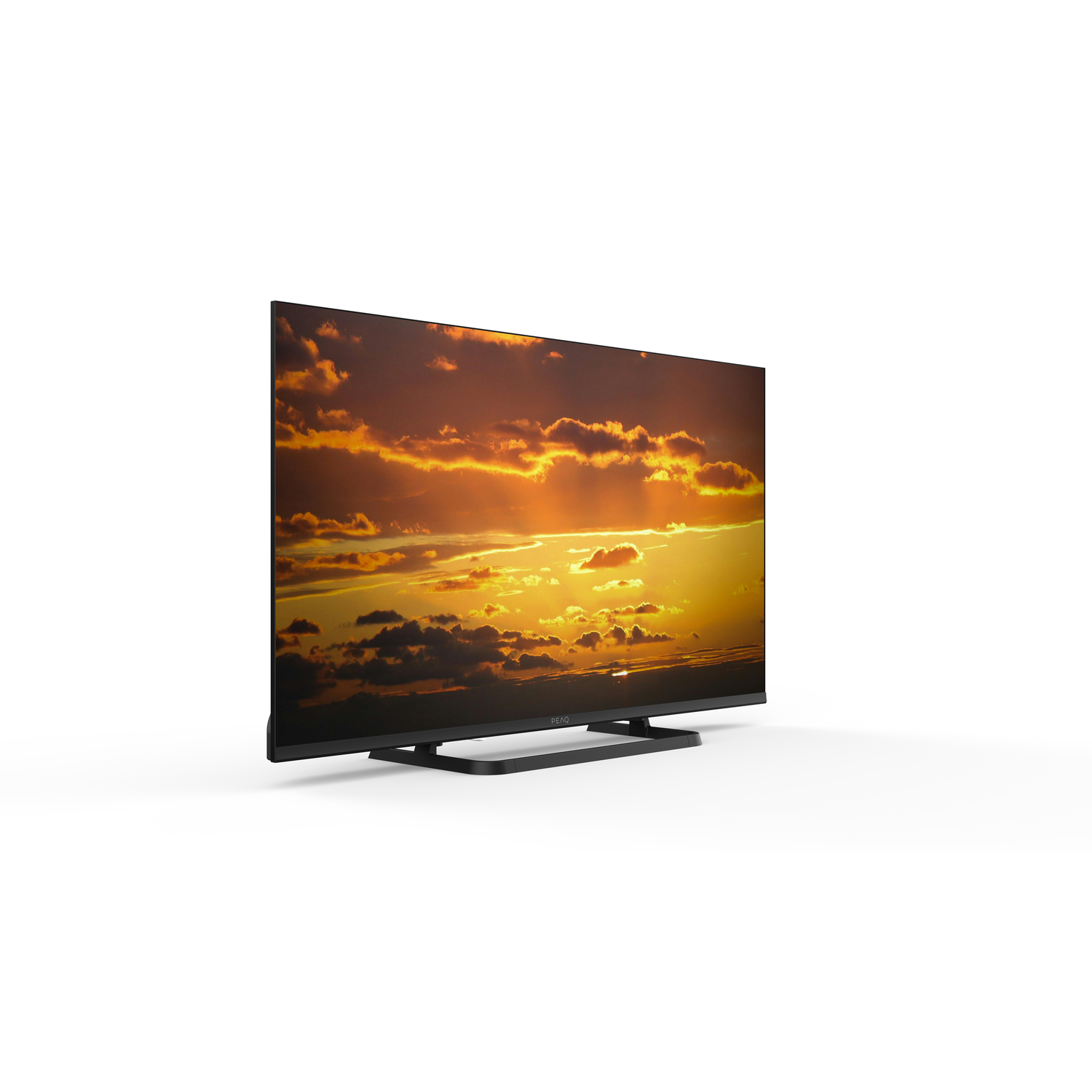 A TV displays a sunset image. The TV is black and sits on a black stand. The background is plain white.