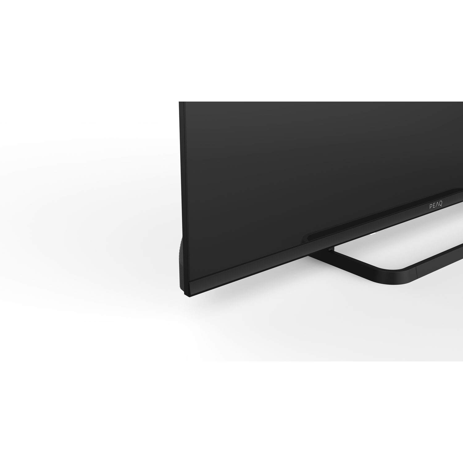 A black PEAQ TV. The screen is visible with its stand on a white background. The stand is black, curved, and supports the TV.
