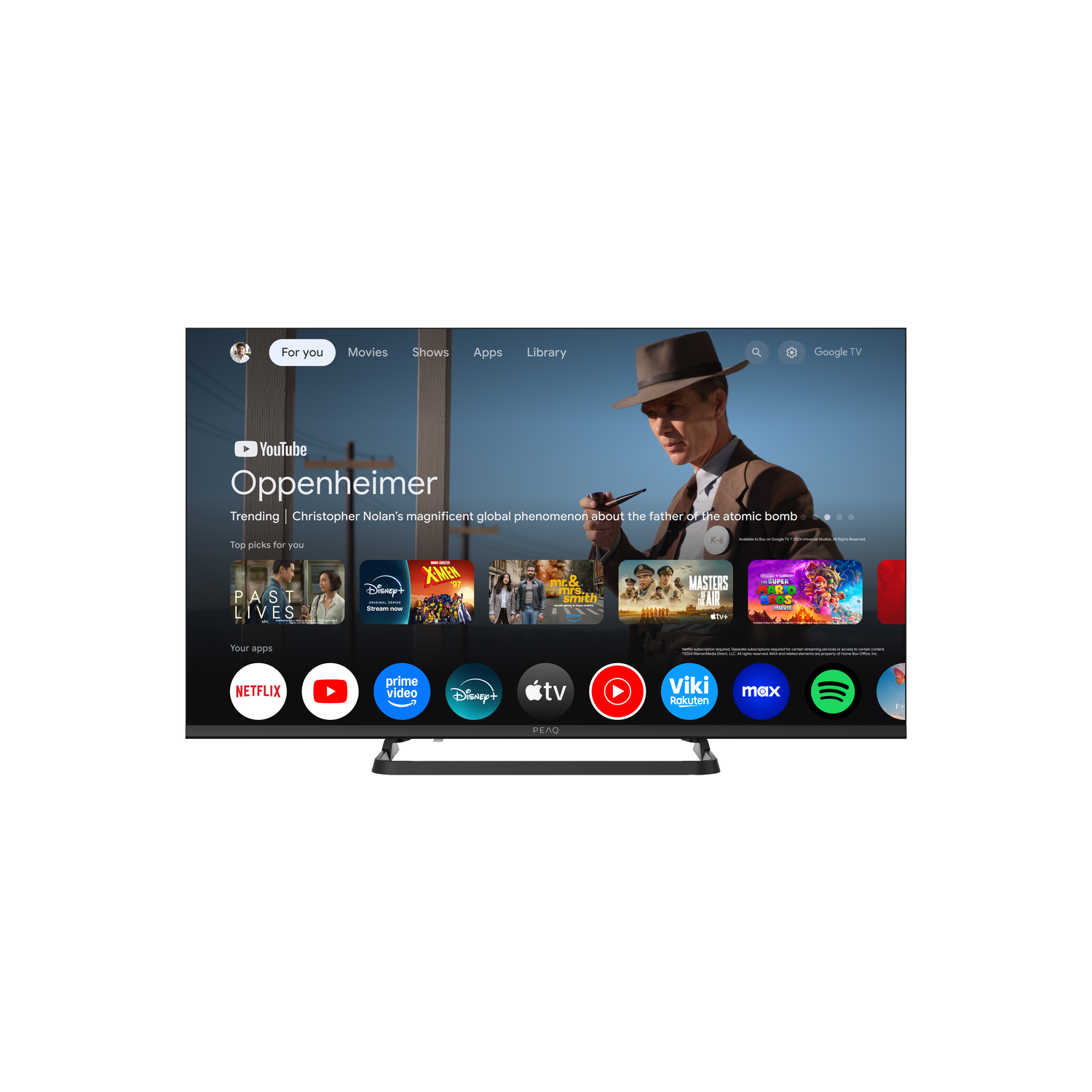 A TV screen displays YouTube with Oppenheimer. Apps like Netflix, Disney+, and others are visible. A man in a hat is on the screen.