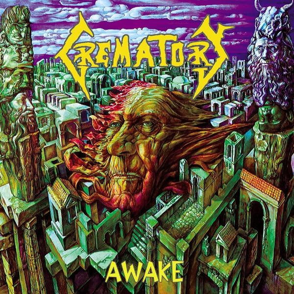Albumcover: Ein großes Gesicht taucht aus einer Stadt auf. Titel 'Krematory' oben und 'Awake' unten. Lila Himmel.