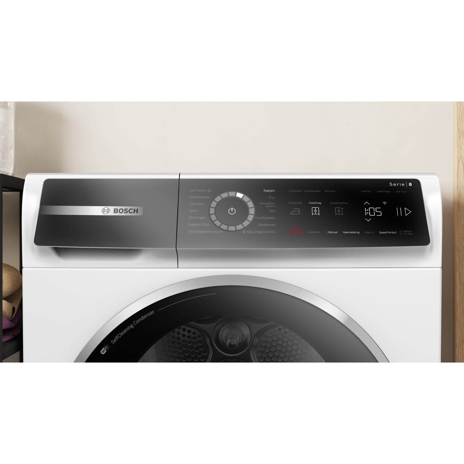 A white Bosch Series 8 dryer with a digital display, control panel, and a self-cleaning condenser. The time shown is 1:05.