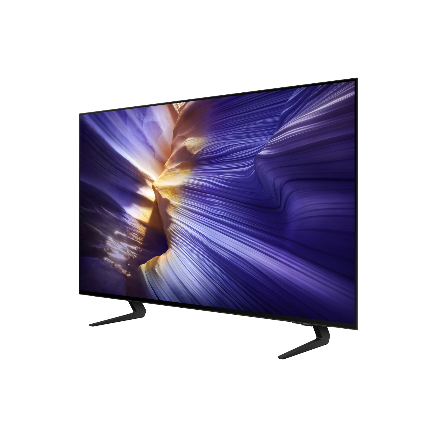 A flat-screen TV with a black frame stands on black legs. The screen displays a swirling pattern of purple and gold colors.