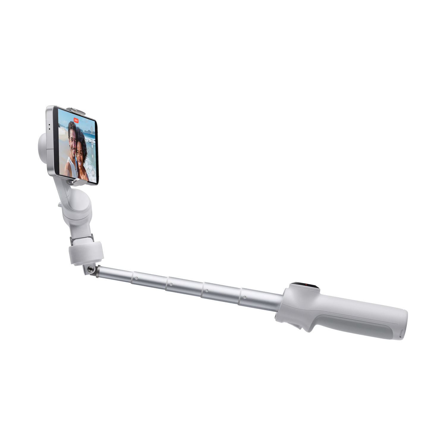 Un bastone per selfie bianco con un telefono che mostra una coppia sulla spiaggia. Il bastone è esteso, isolato su sfondo bianco.