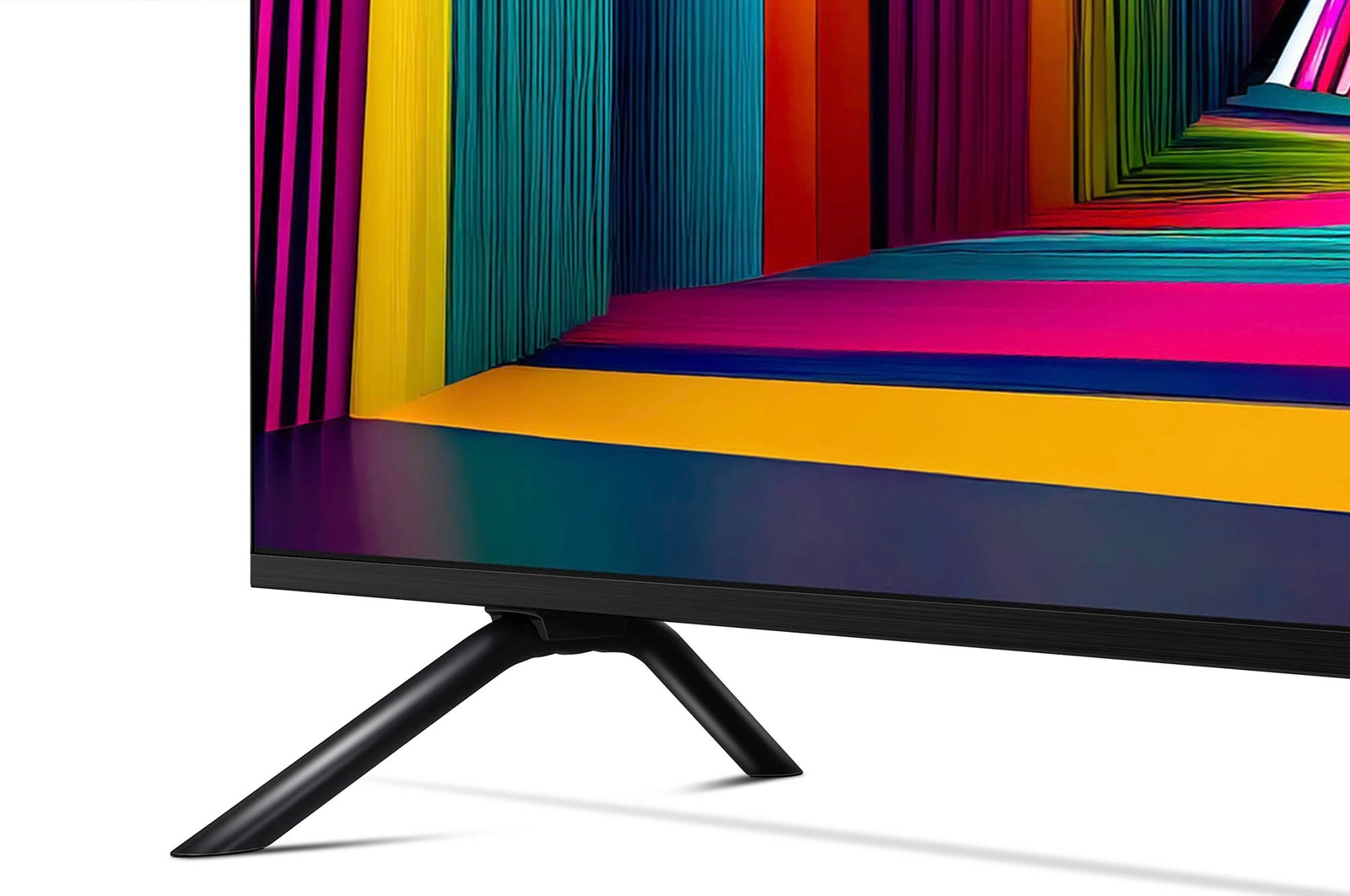 Egy fekete TV színes háttérrel. A háttér különböző színű csíkokkal rendelkezik, a TV fehér felületen áll.