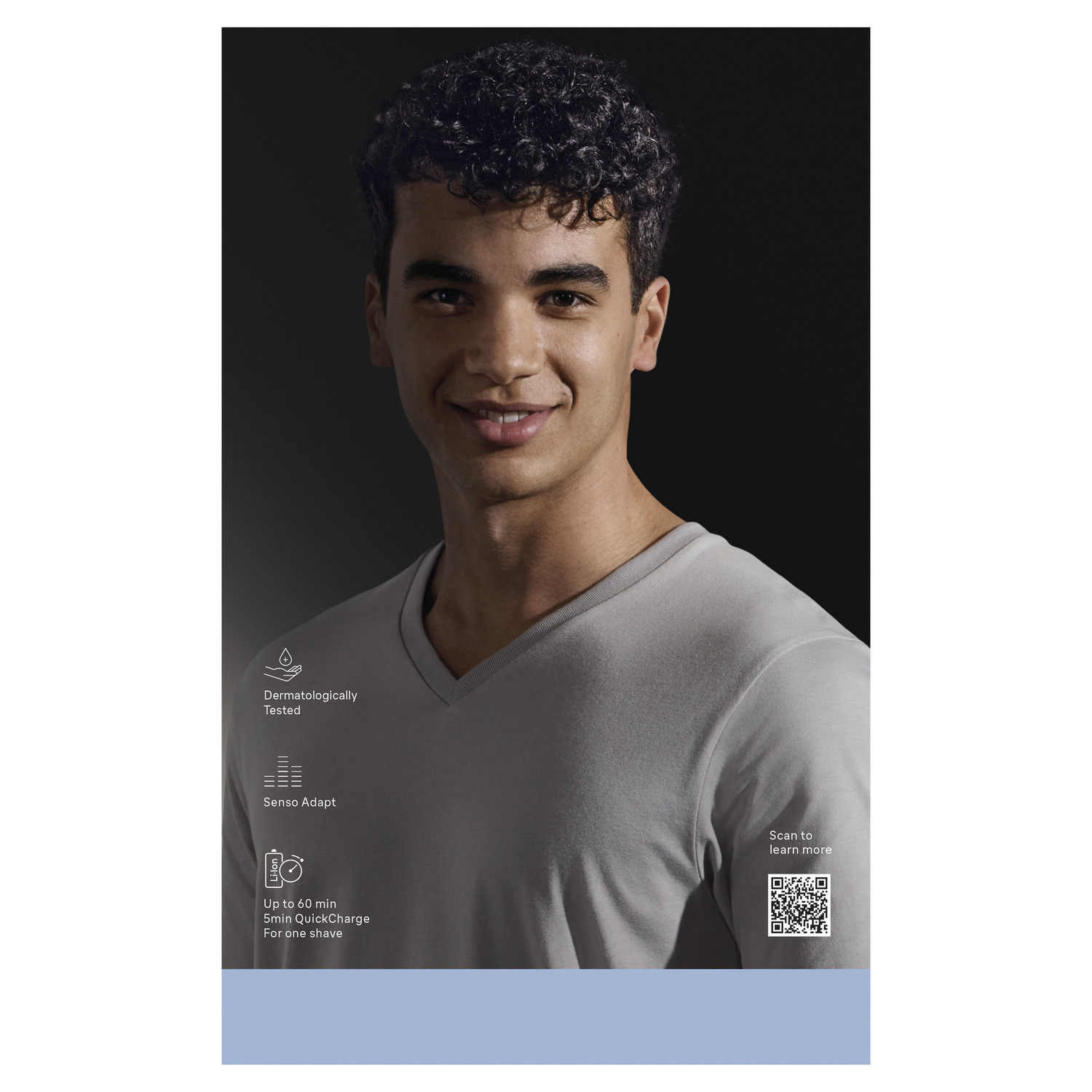 A smiling man with curly hair wears a grey shirt. Text highlights dermatologically tested and quick charge features.