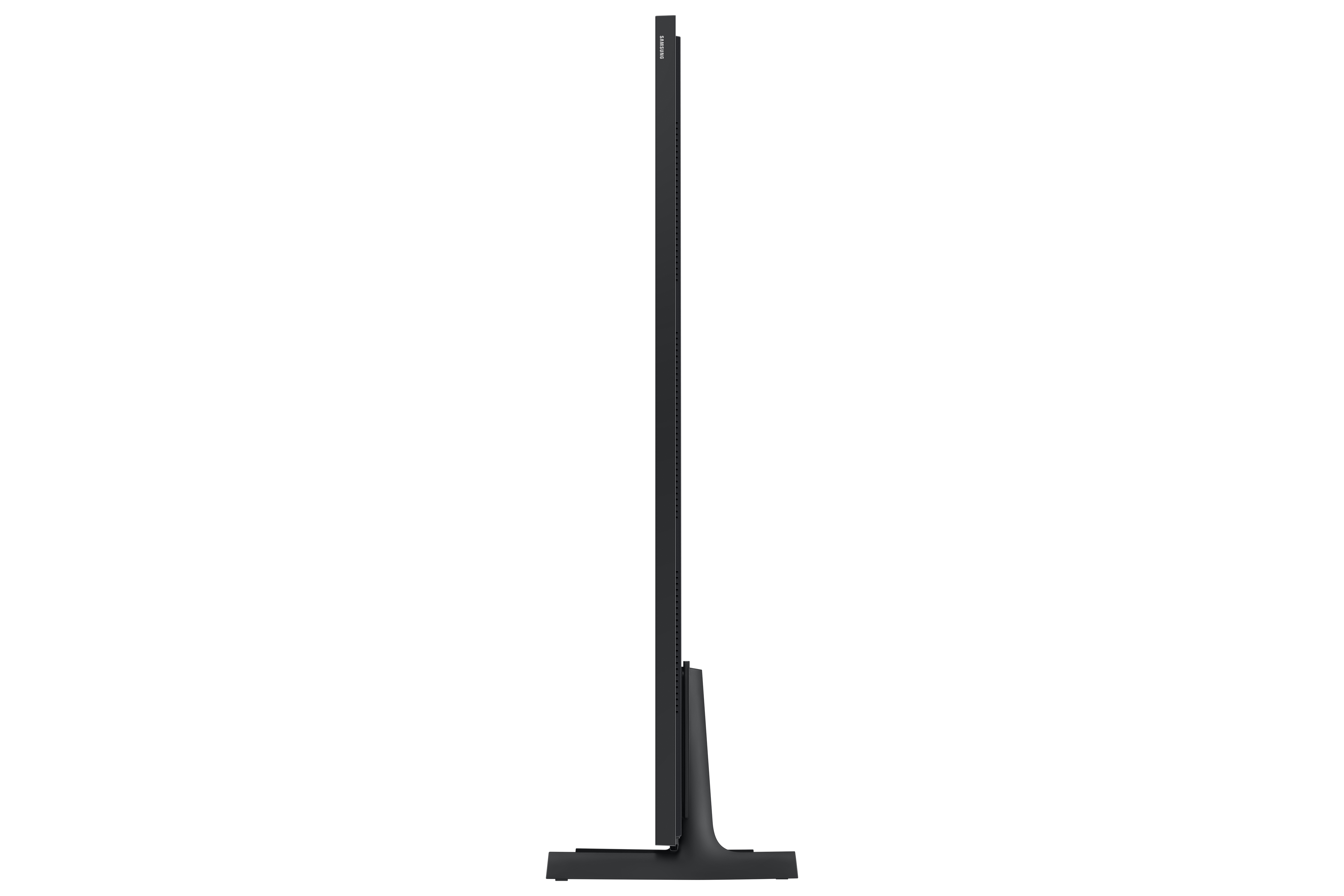 Un televisore Samsung nero, visto di lato, su sfondo bianco. Il televisore è alto e sottile, con base rettangolare.