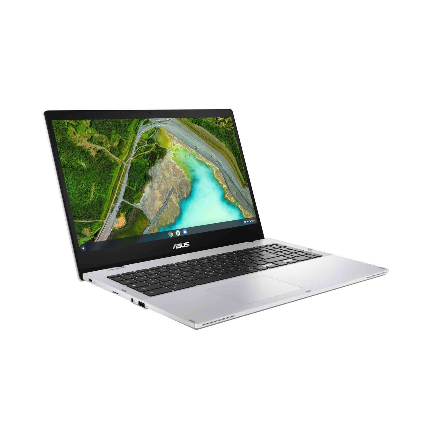 Silver ASUS laptop on white background. The screen displays a landscape with green trees and turquoise water.