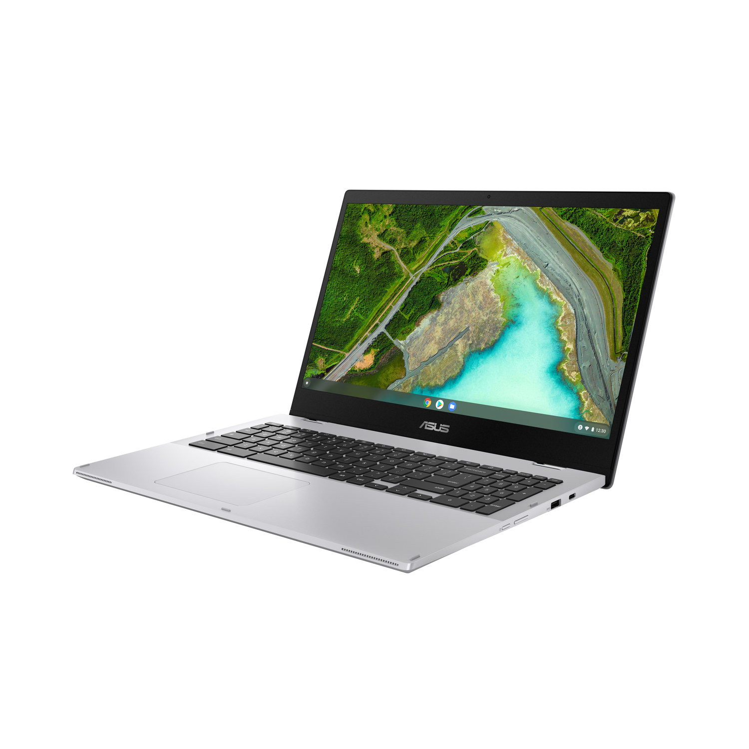 A silver Asus laptop is angled to the right. The screen shows a landscape with green trees and blue water.