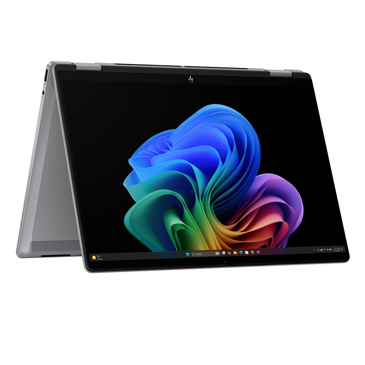 Ordenador portátil plateado con pantalla negra que muestra una imagen abstracta colorida. La pantalla está abierta.