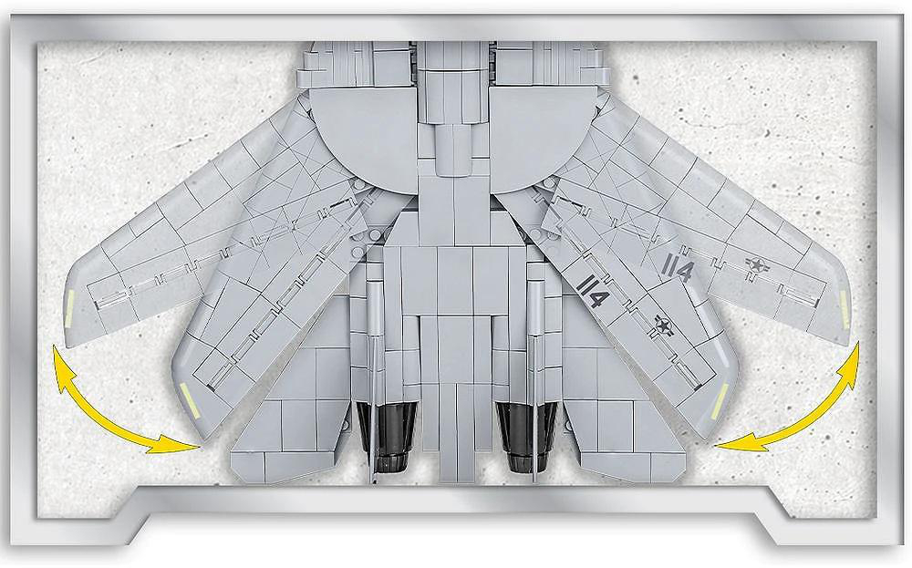 Ein graues Modellflugzeug mit sich bewegenden Flügeln, das den Mechanismus des Fl ügelpfeils zeigt. Die Nummer 114 ist auf den Flügeln zu sehen.