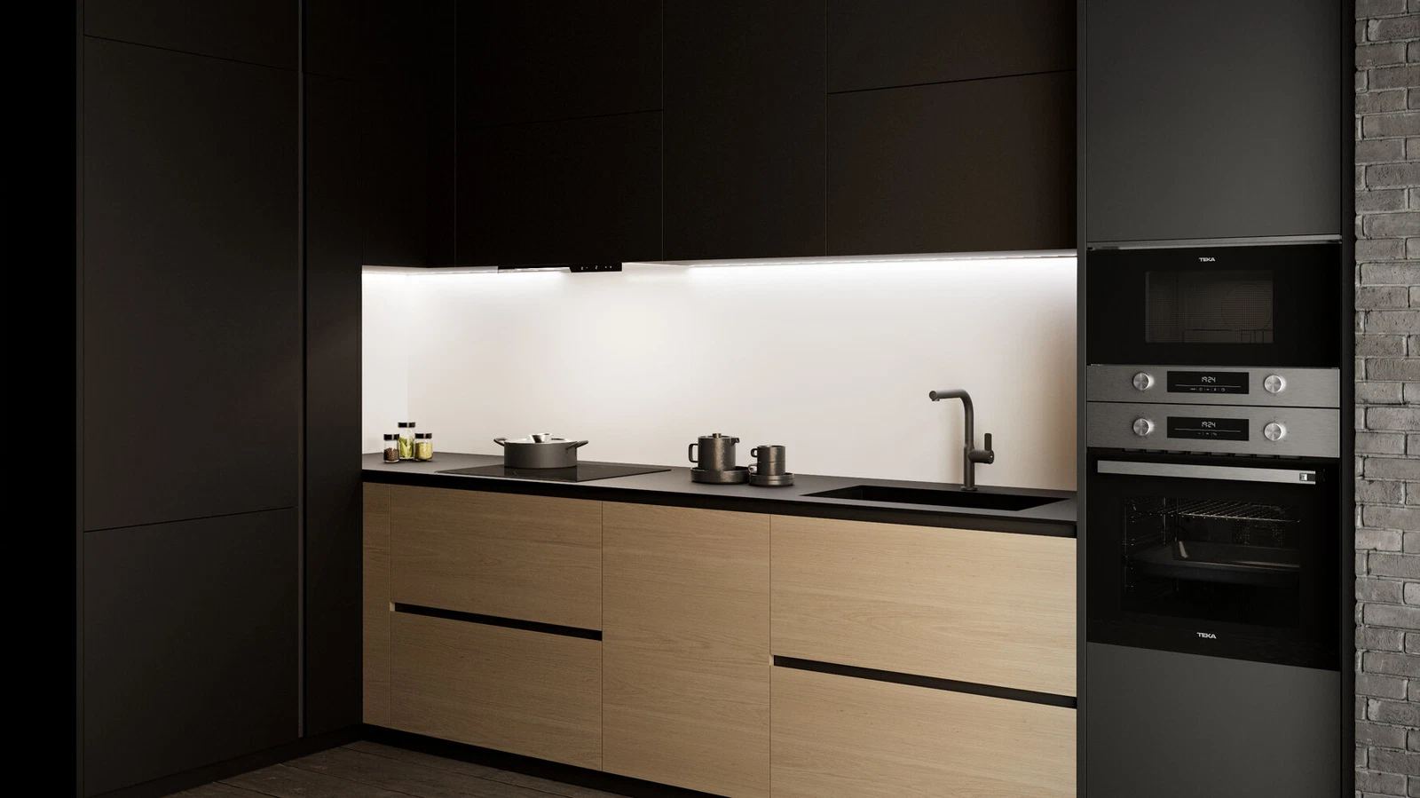 Cocina moderna con armarios negros, cajones de madera y electrodomésticos de acero inoxidable. Incluye un fregadero, una encimera y una pared de ladrillo.