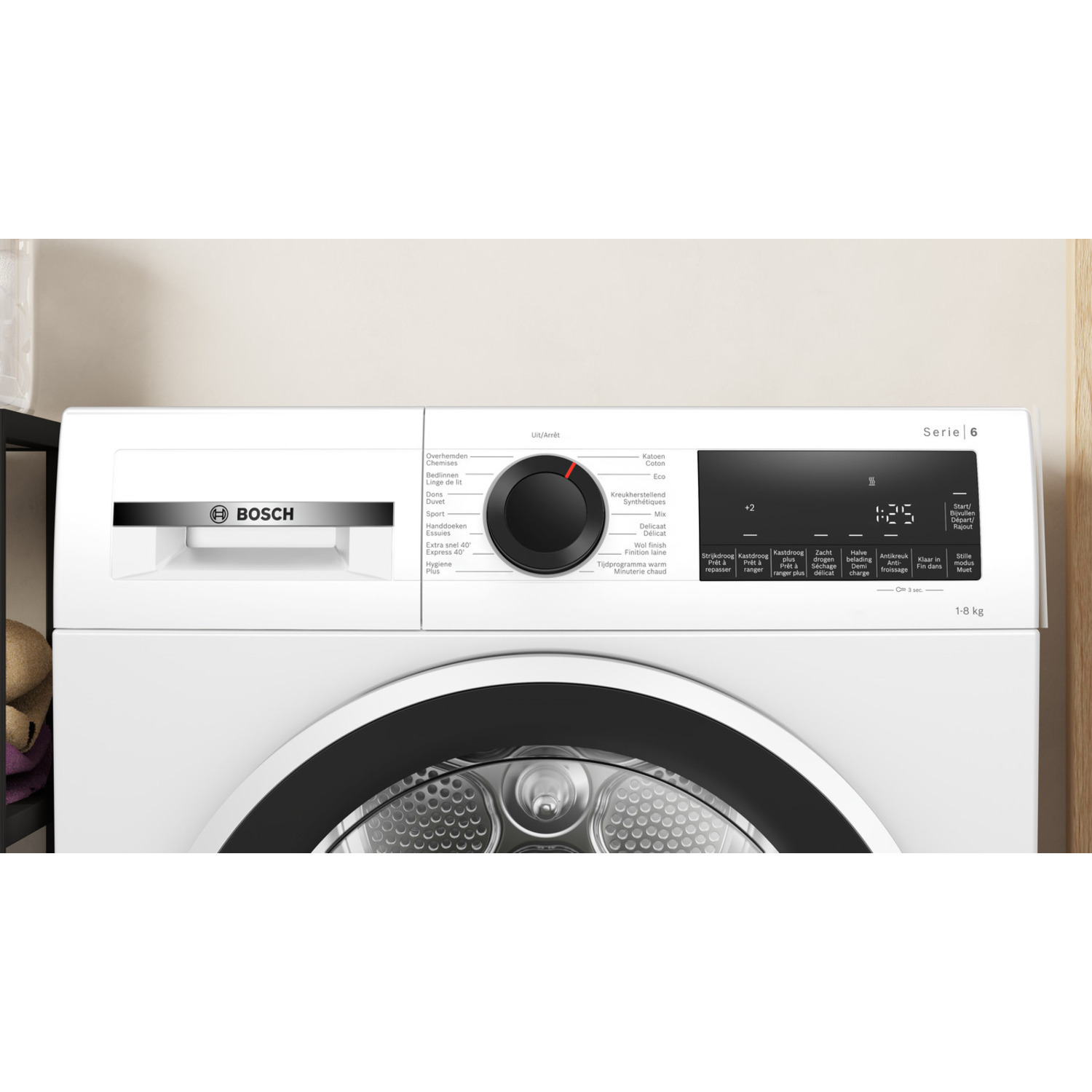 A white Bosch dryer with black dial and digital display. Labels indicate different drying settings.
