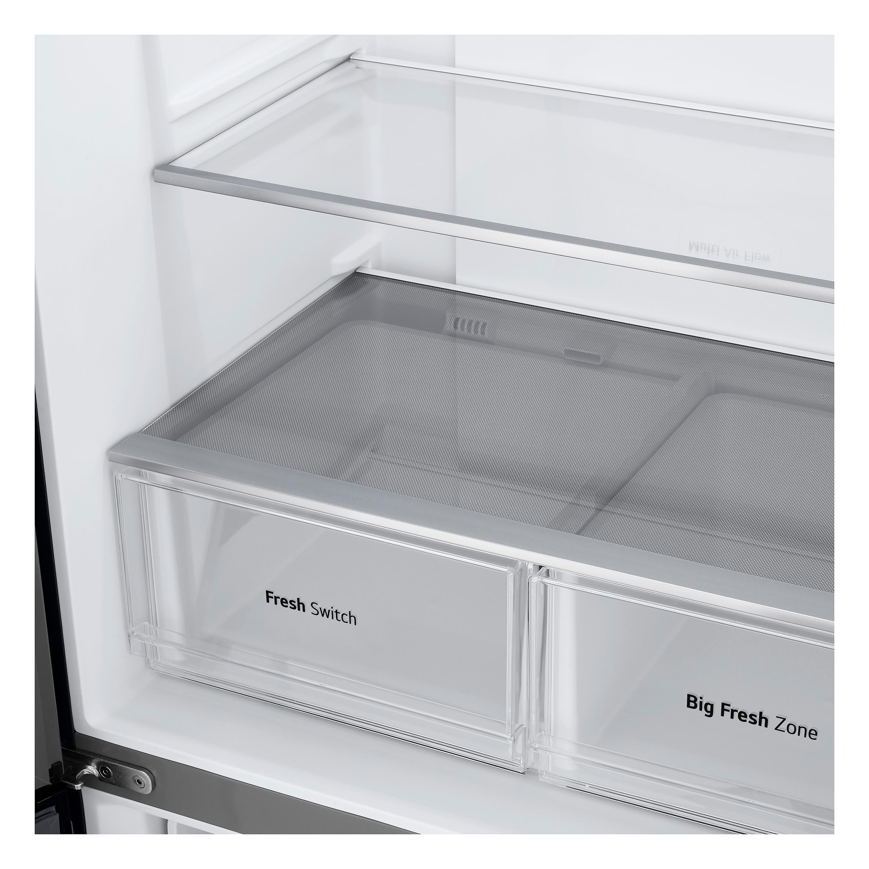 In einem Kühlschrank sind zwei transparente Schubladen zu sehen. 'Fresh Switch' und 'Big Fresh Zone' sind beschriftet. Ein Netzregal befindet sich darüber.