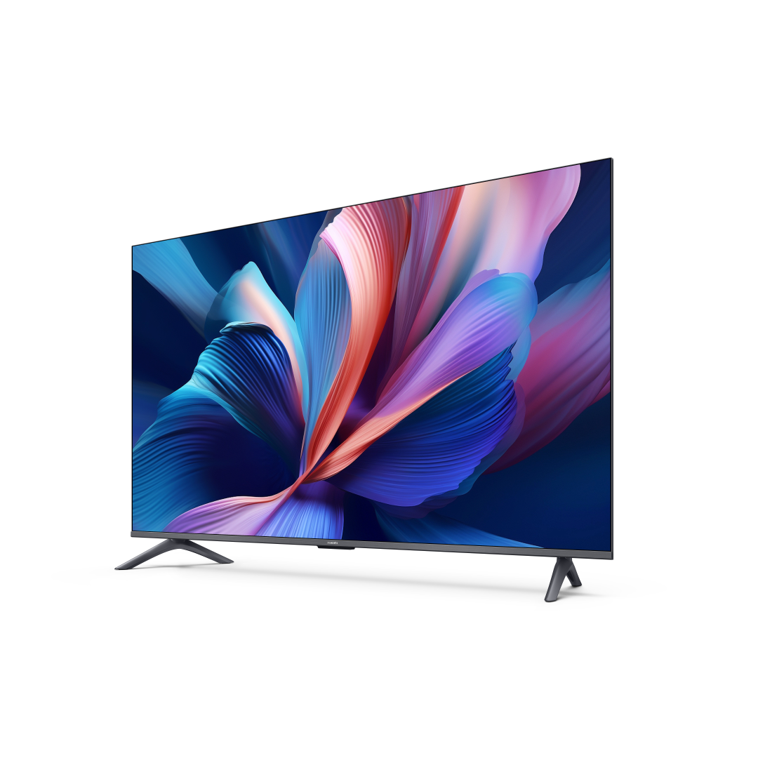 Nowoczesny telewizor wyświetla abstrakcyjny kwiatowy wzór w kolorach niebieskim, fioletowym i pomarańczowym. Telewizor jest na czarnym tle.