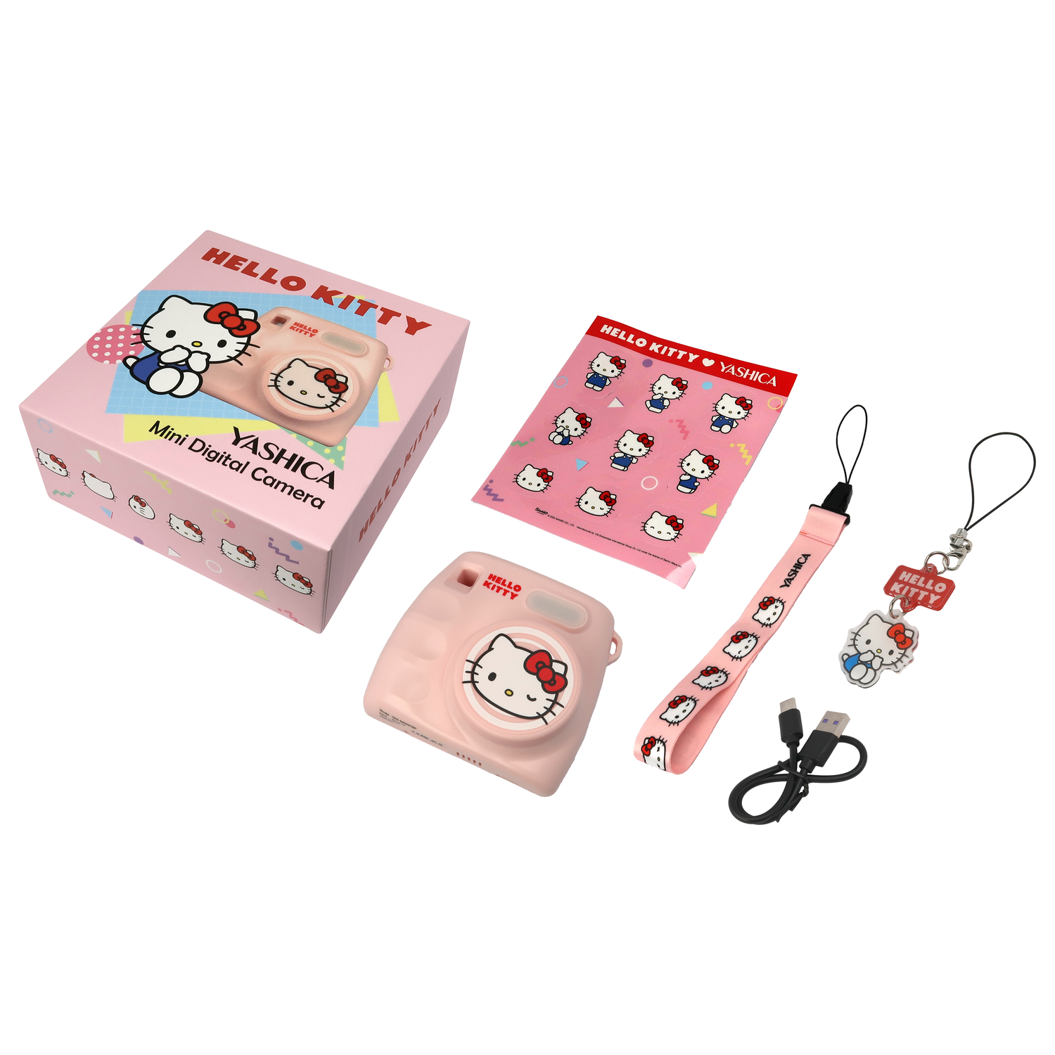 A Hello Kitty digital camera set on a white background. Includes a pink camera, box, stickers, strap, and charm.