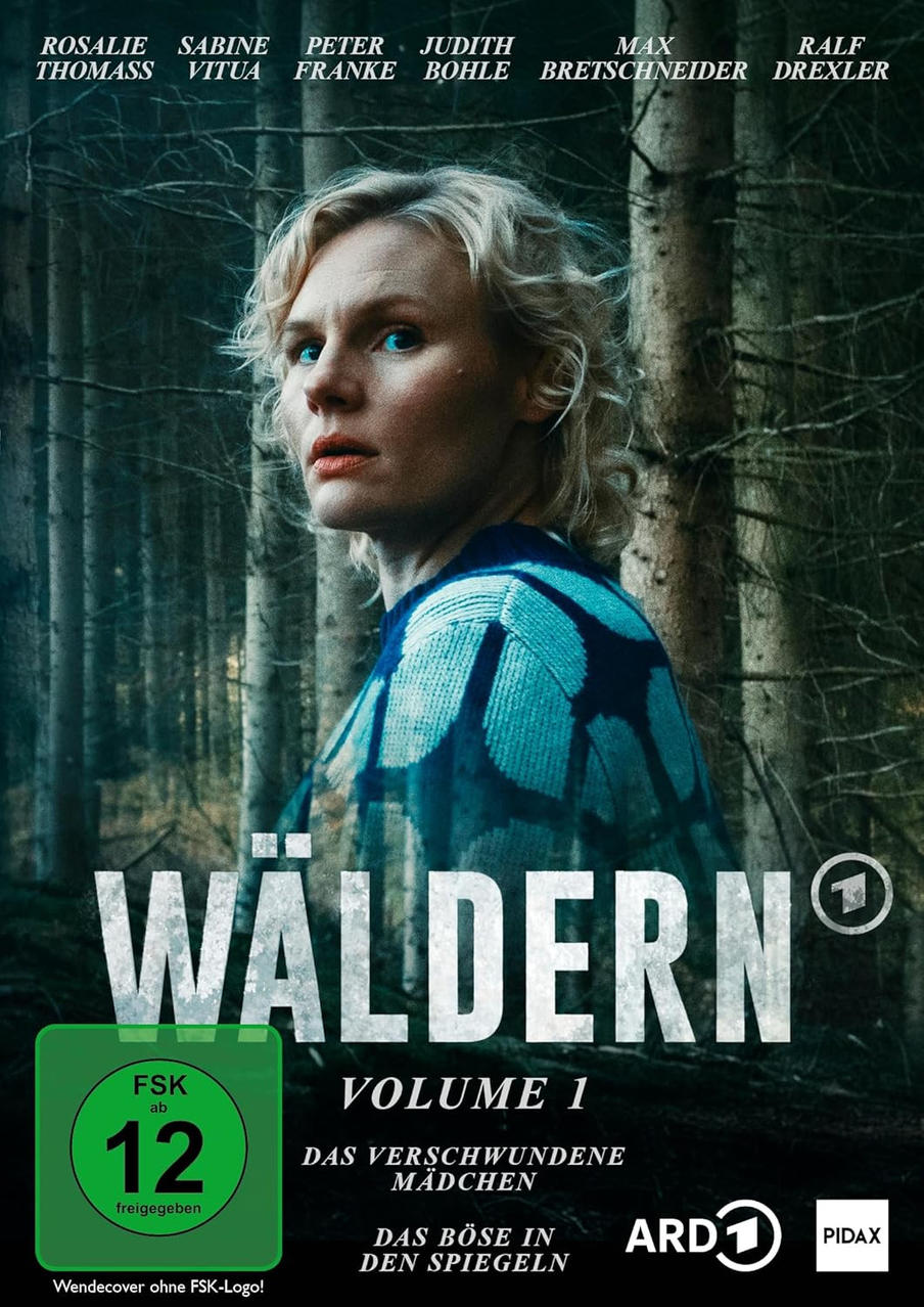 Cover von 'Wäldern Band 1'. Eine Frau in blauem Pullover steht im Wald. Text enthält Titel, Schauspielernamen und FSK-Kennzeichnung.