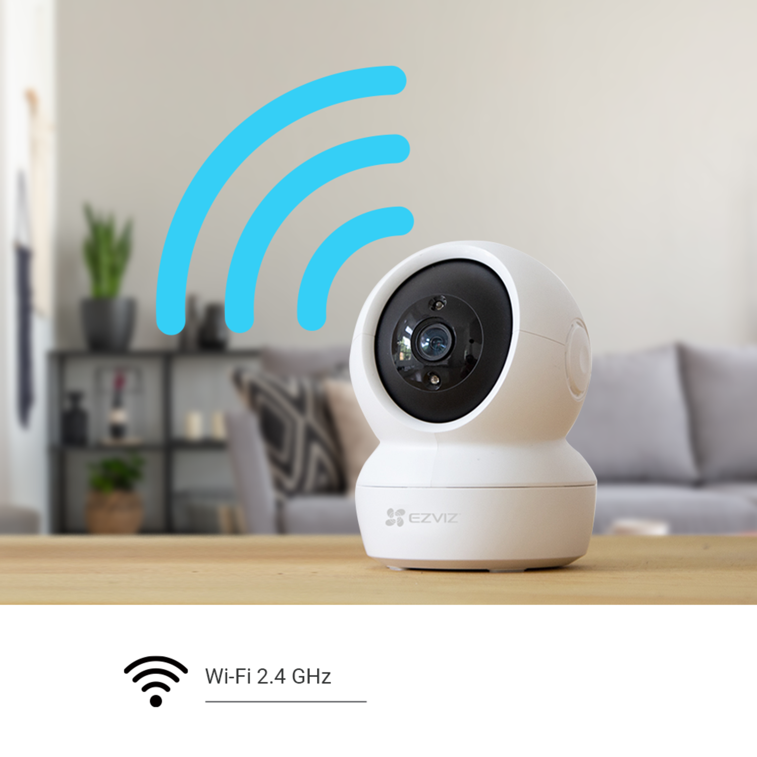 White security camera with blue Wi-Fi signal. Background shows a living room. Table is in the foreground.