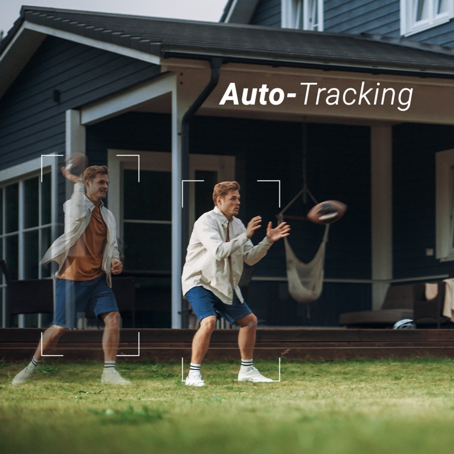 Man throwing a football on the lawn. A house in the background has 'Auto-Tracking' text.