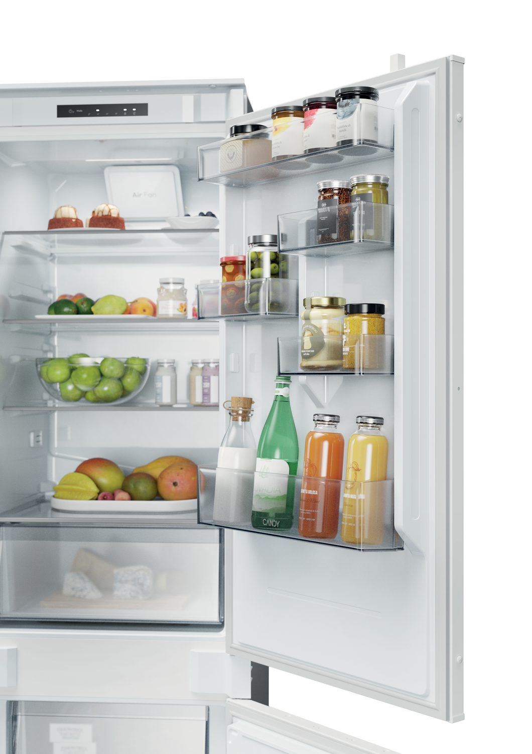 Refrigerador abierto lleno de frutas, verduras, frascos y botellas. Incluye manzanas, mangos, zumos y lácteos.