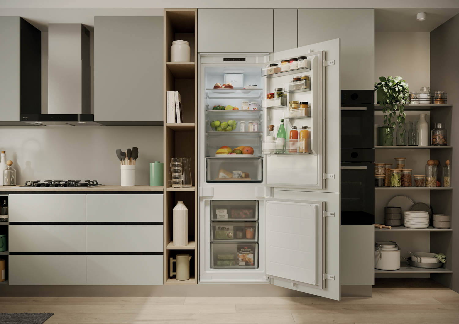 Cocina moderna con refrigerador abierto lleno de alimentos, electrodomésticos empotrados y estantes con varios artículos.