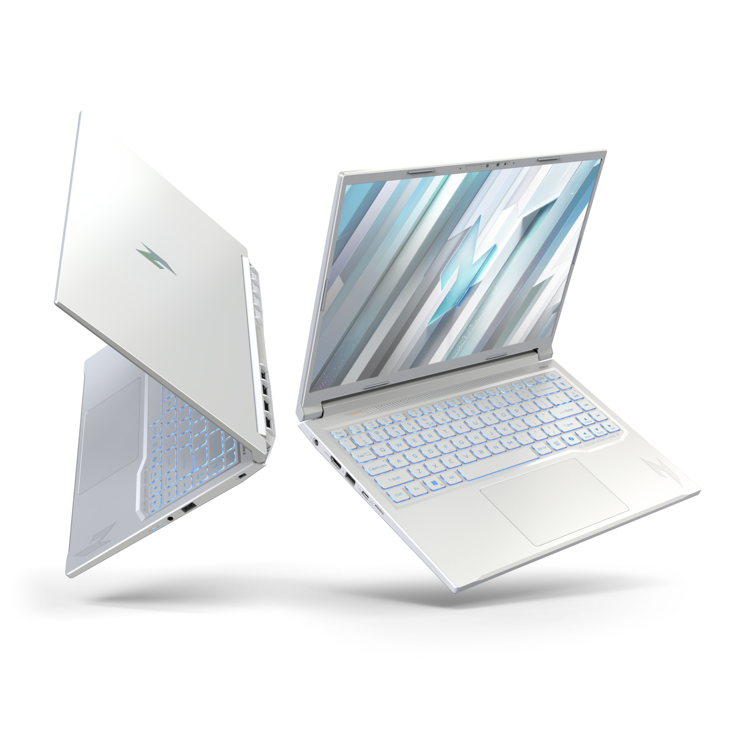 Two white laptops are displayed. One is closed, the other open, showing a blue-lit keyboard and a screen with abstract design. White background.