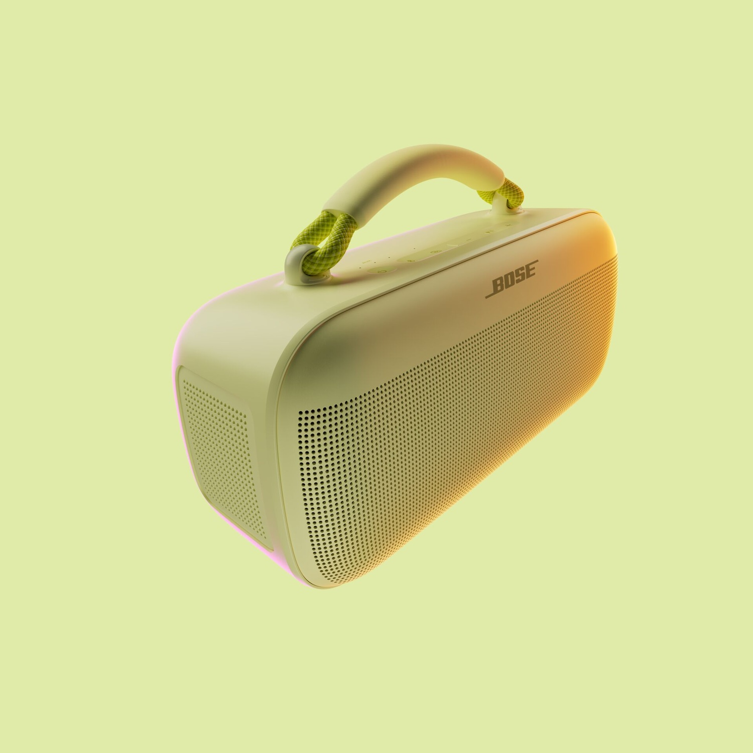 Un altoparlante portatile Bose verde chiaro con maniglia. La maniglia ha una corda verde e bianca. Lo sfondo è verde chiaro.
