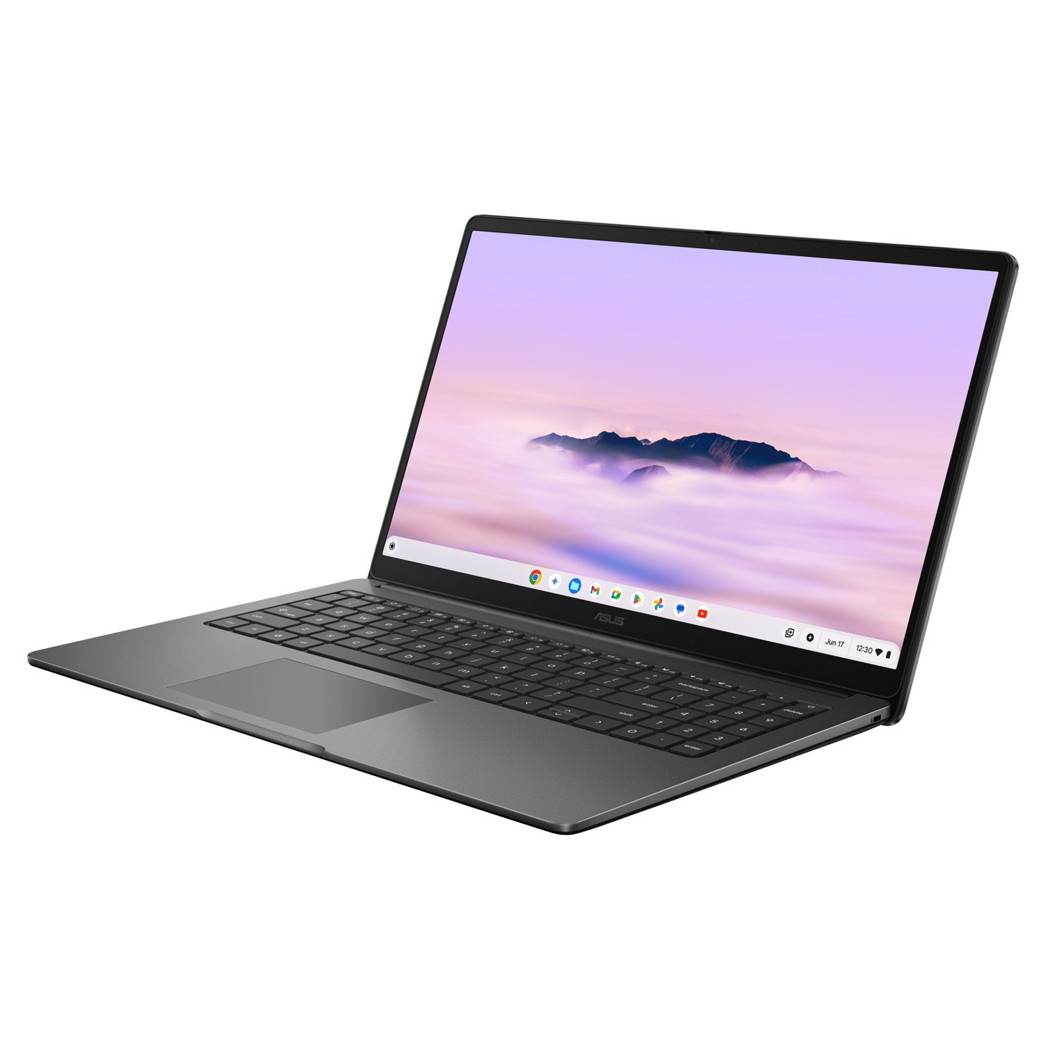 A gray ASUS laptop is open, angled slightly. The screen displays a mountain landscape. The keyboard is visible. 