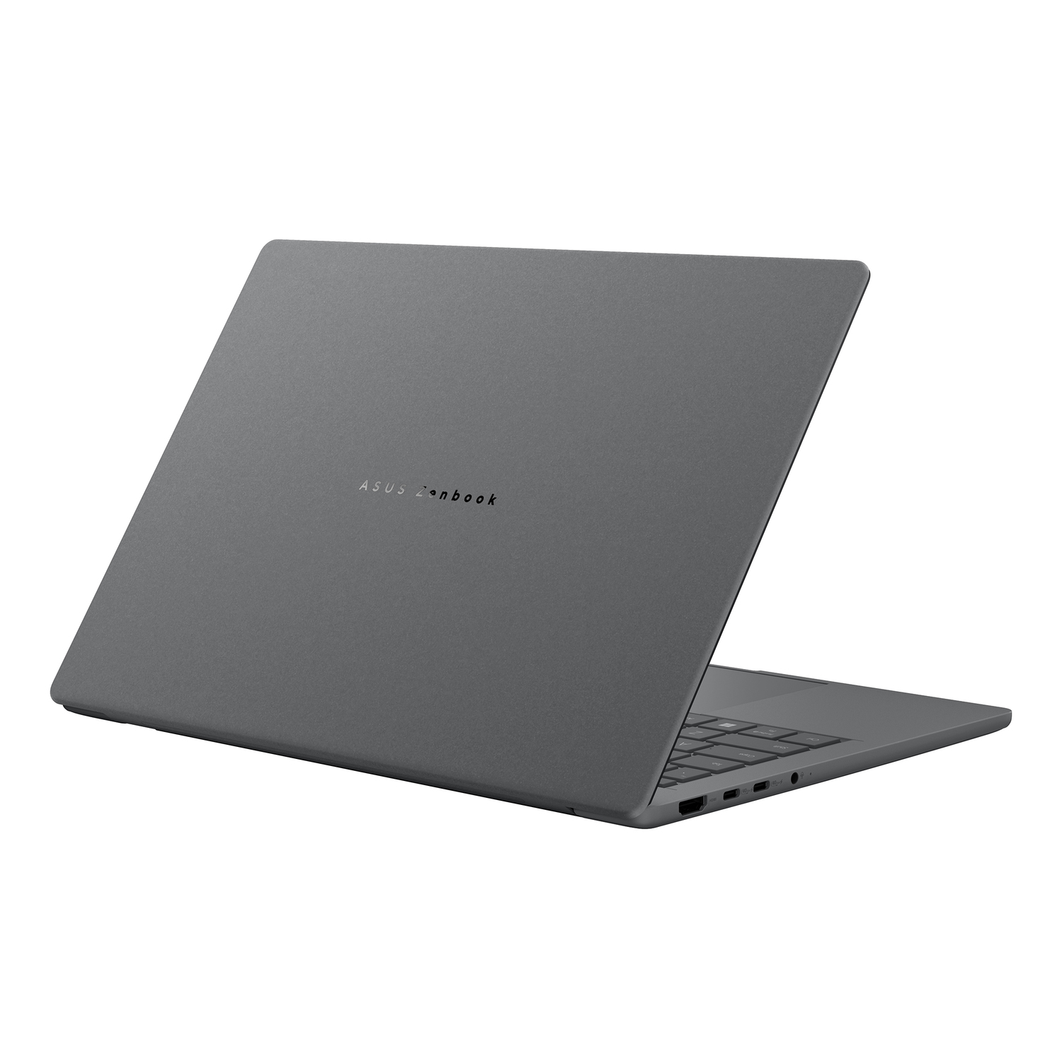 Un ordinateur portable ASUS Zenbook gris est ouvert sur une surface blanche. L'écran est incliné vers le haut. L'ordinateur est gris avec un clavier.