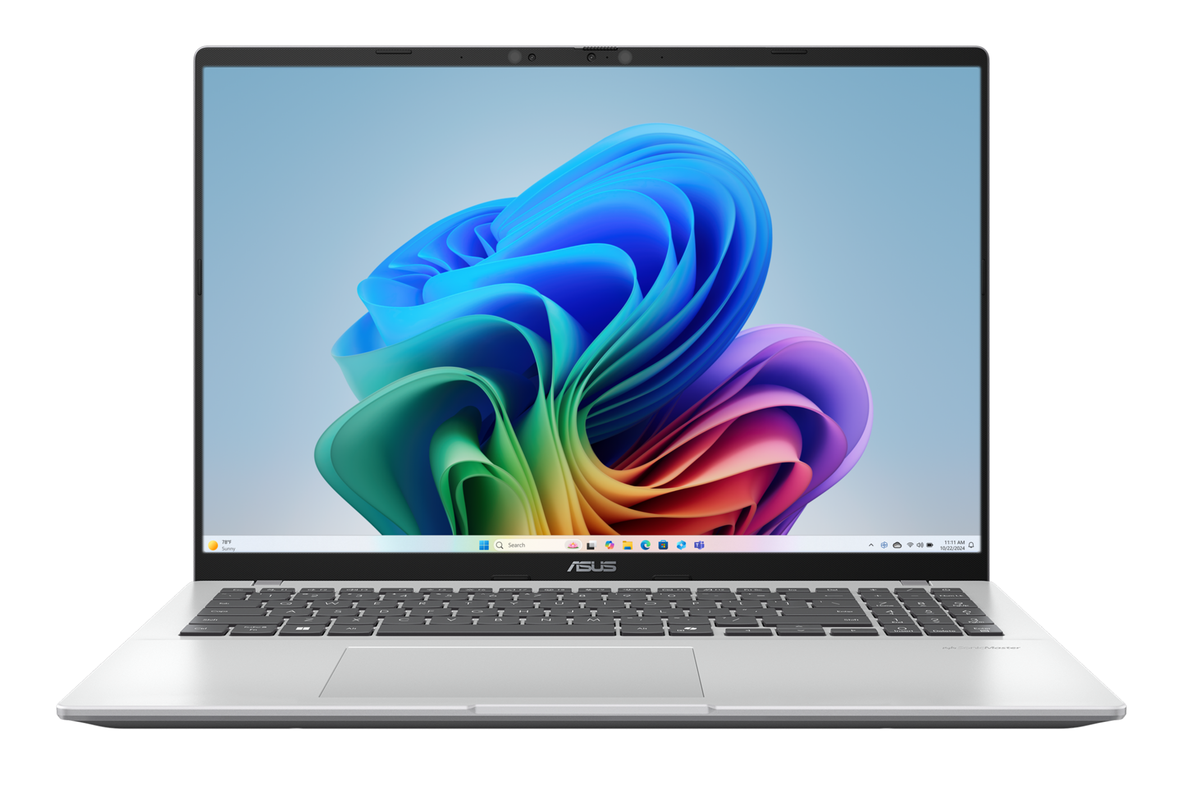 Srebrny laptop z kolorową, abstrakcyjną tapetą. Ekran pokazuje interfejs Windows.