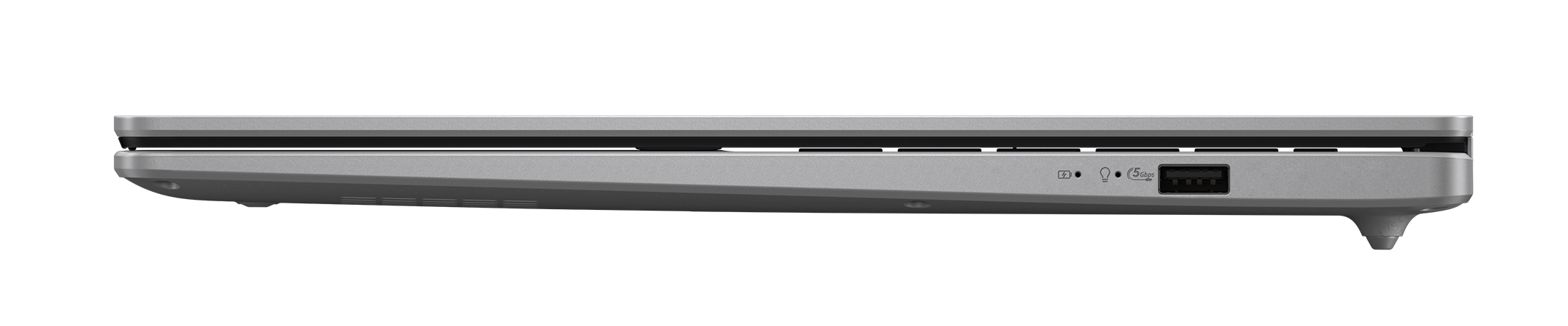 Widok z boku srebrnego laptopa. Widoczne porty USB, słuchawki i zasilanie. Tło jest czarne.