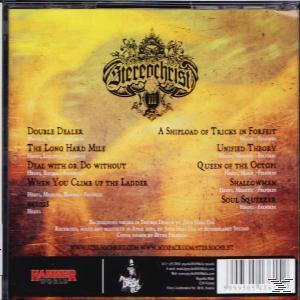 Album borító 'Stereochrist' logóval, számcímekkel és HammerWorld logóval. A háttér sárga és barna.