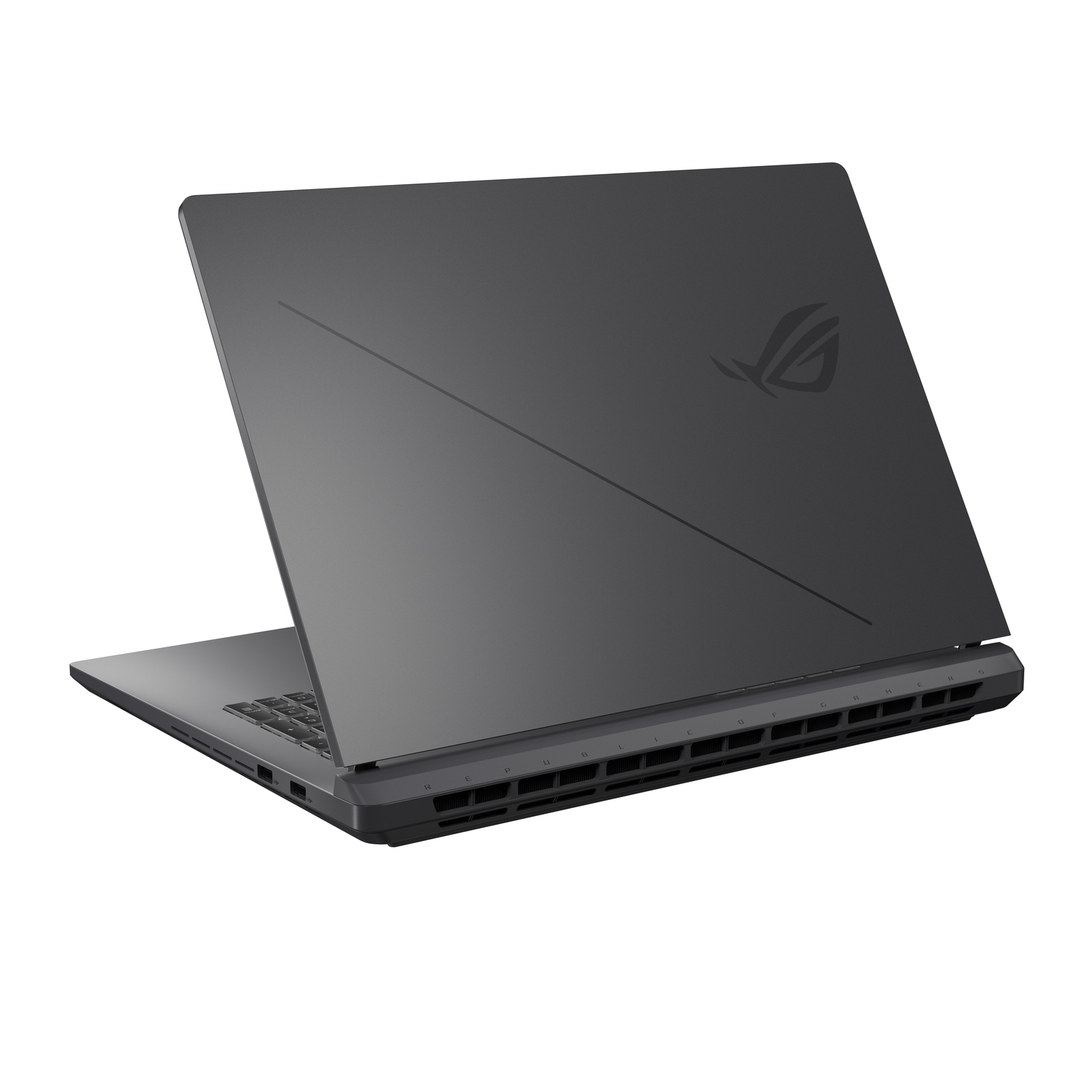 A dark gray laptop is open, showing the keyboard and the back with the ROG logo. The laptop is angled slightly, revealing its side ports.