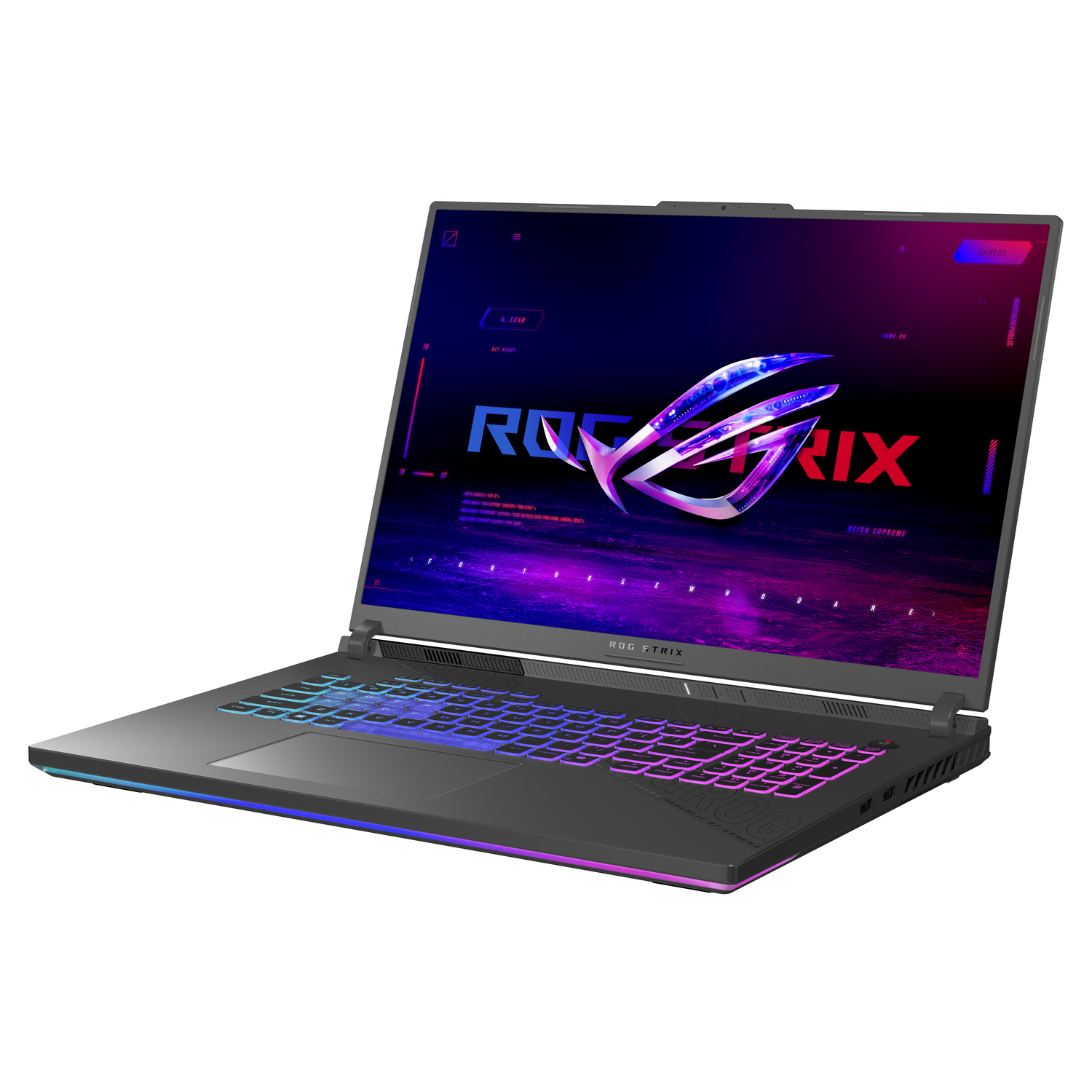 A gray laptop with an illuminated keyboard displays a colorful graphic. The ROG Strix logo is prominent on the screen.