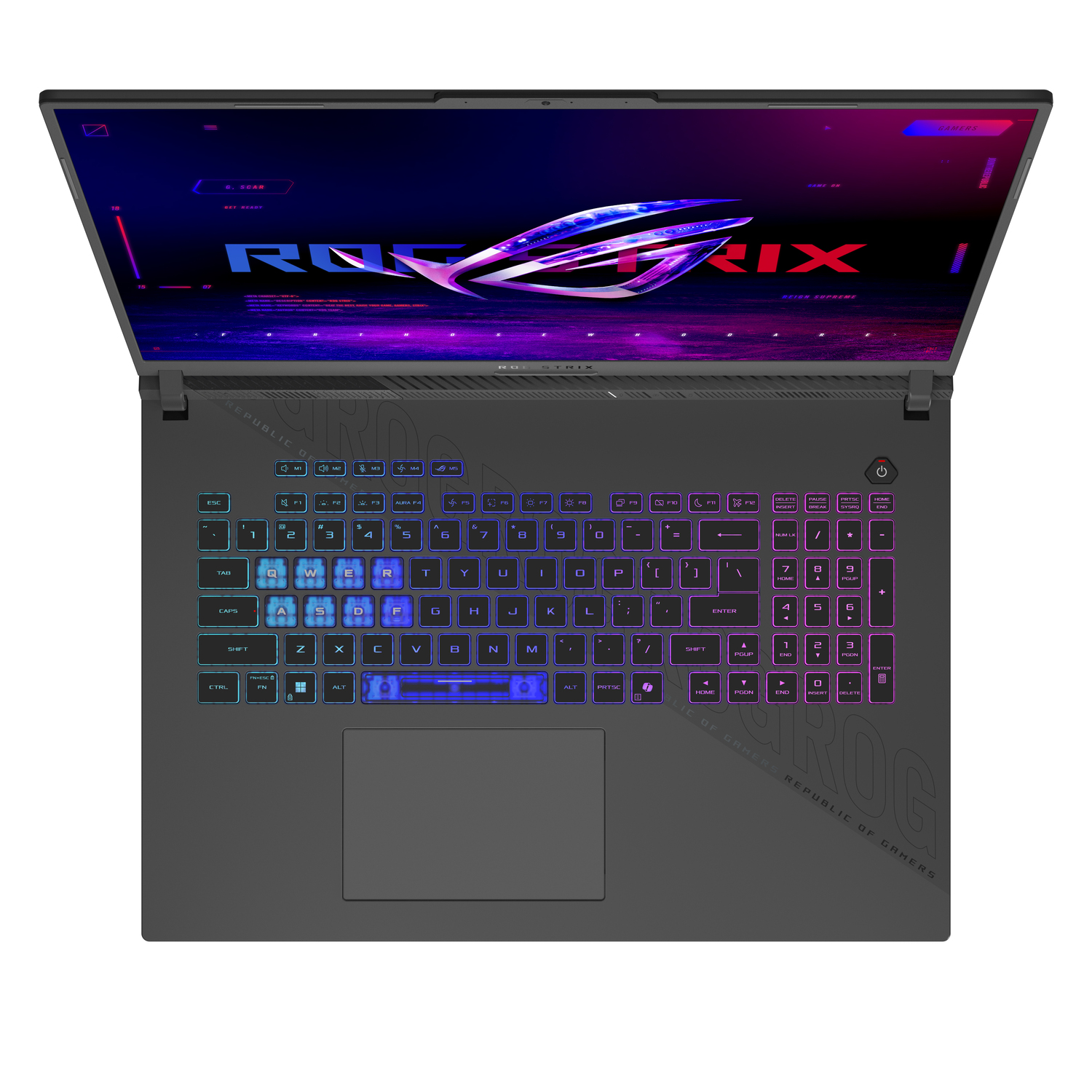 A grey ROG laptop with a lit screen displaying the ROG Strix logo. Keyboard keys have RGB lighting. The laptop is open.