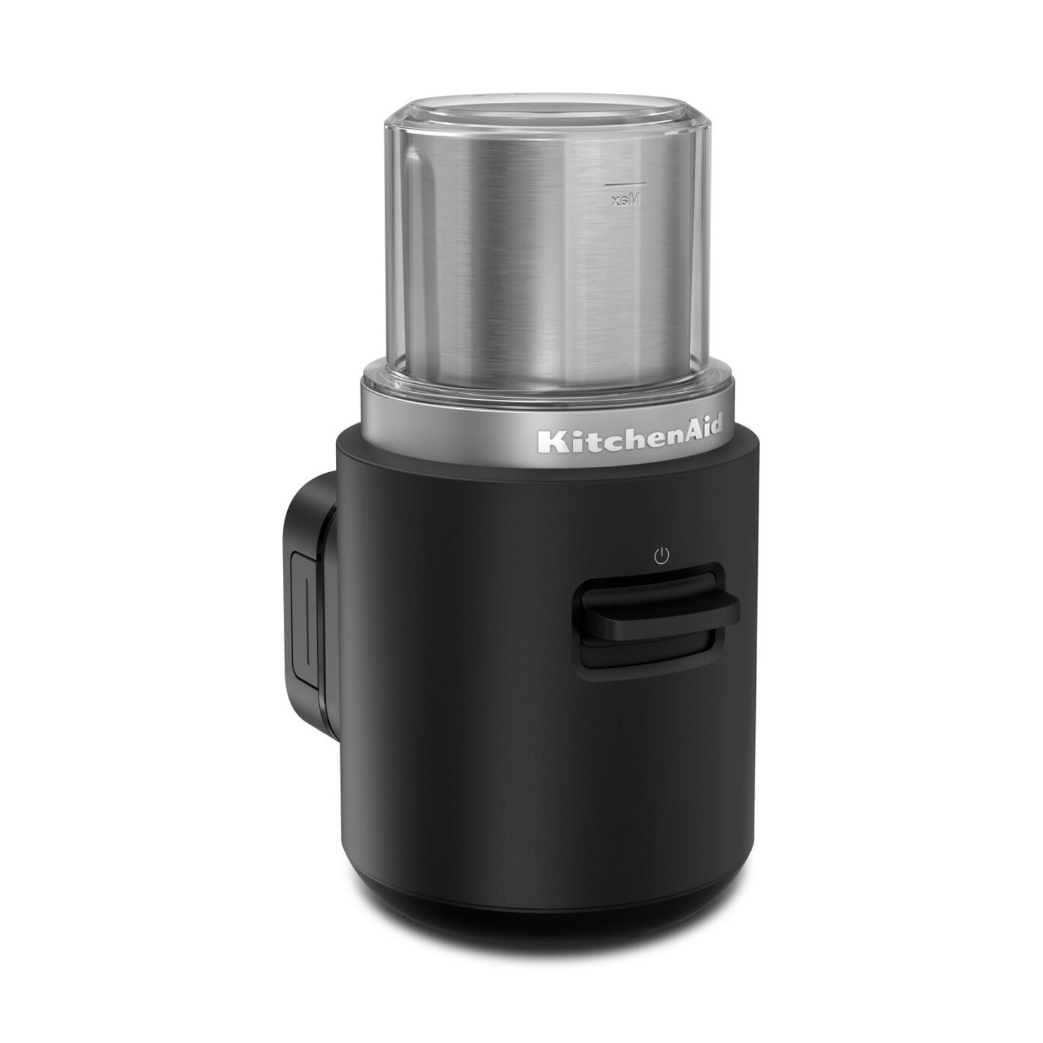 Un macinacaffè KitchenAid nero con parte superiore argentata e un contenitore trasparente. Ha un pulsante di accensione.