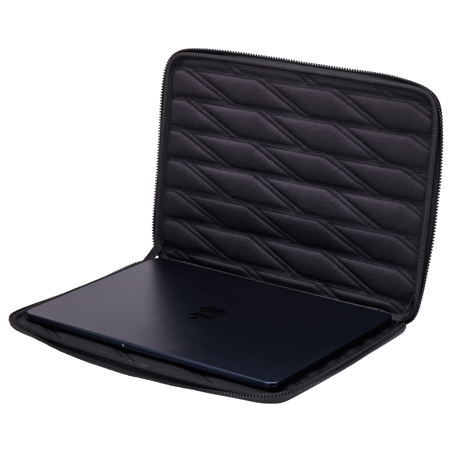 A black laptop is inside a black quilted laptop sleeve. The sleeve is open. The background is white.