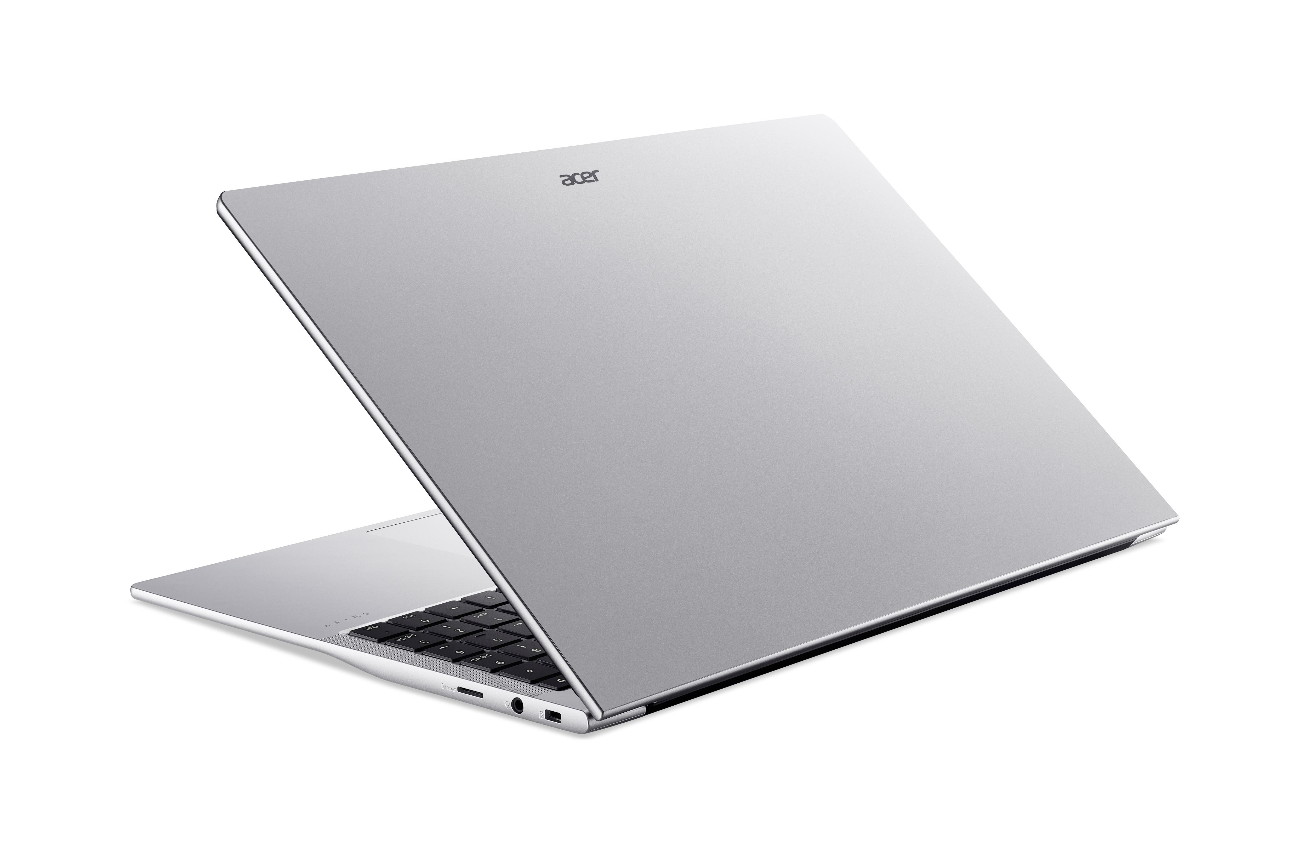 Silberner Acer-Laptop, geöffnet. Der Bildschirm ist geneigt. Acer-Logo sichtbar. Tastatur und Anschlüsse sichtbar.