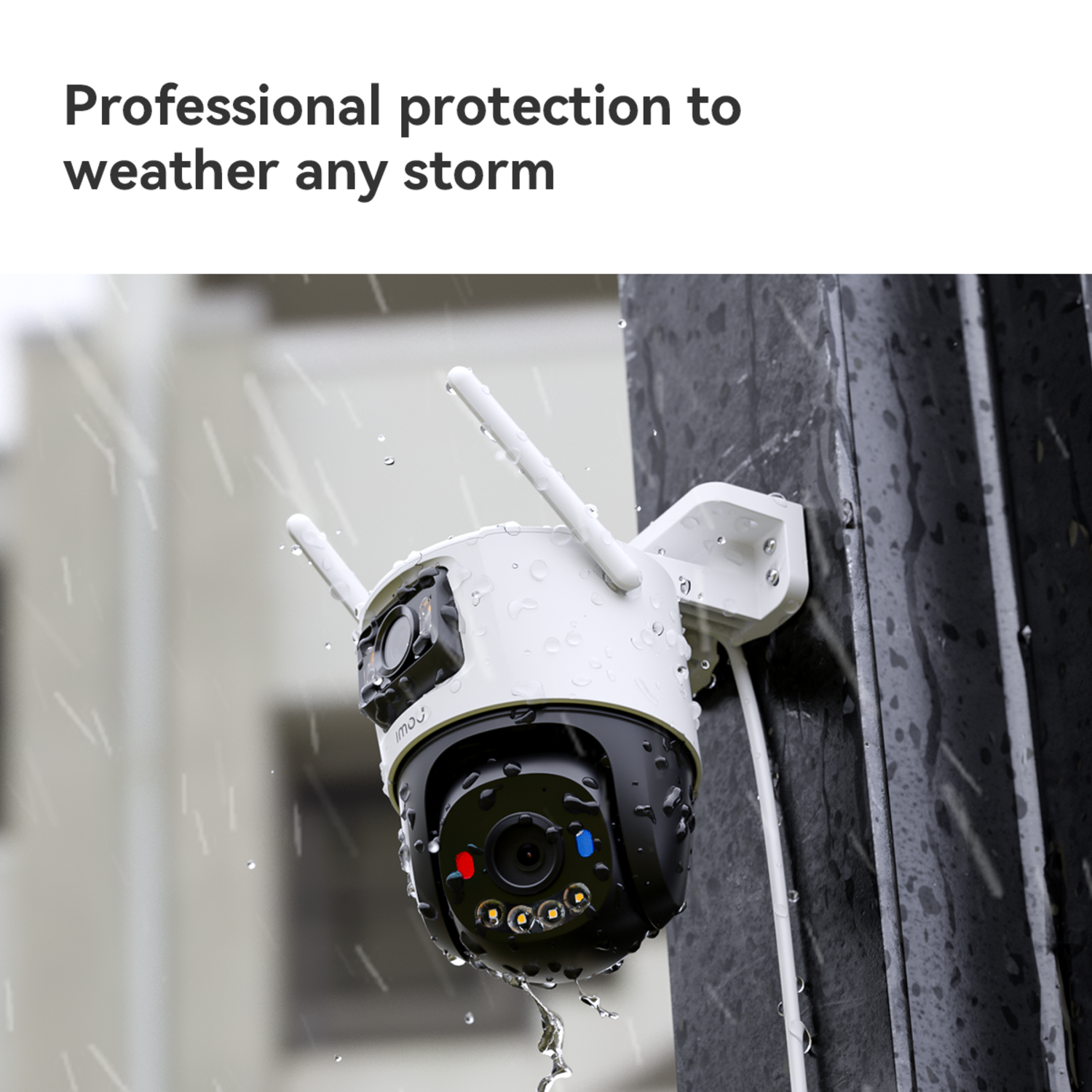 A white and black security camera is mounted on a pole in the rain. Water droplets are visible, suggesting weather resistance.