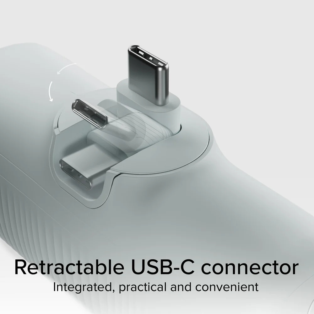 Zbliżenie na chowany konektor USB-C. Jest szary, ze srebrnym konektorem. Tekst na dole: Chowany konektor USB-C.