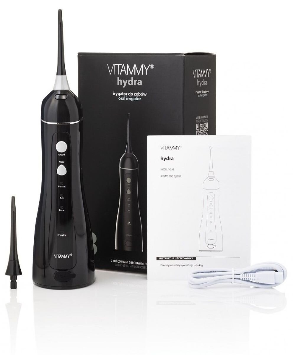 Czarno-biały irygator do jamy ustnej z pudełkiem i instrukcją. Na pudełku napis Vitammy Hydra. To produkt do pielęgnacji zębów.