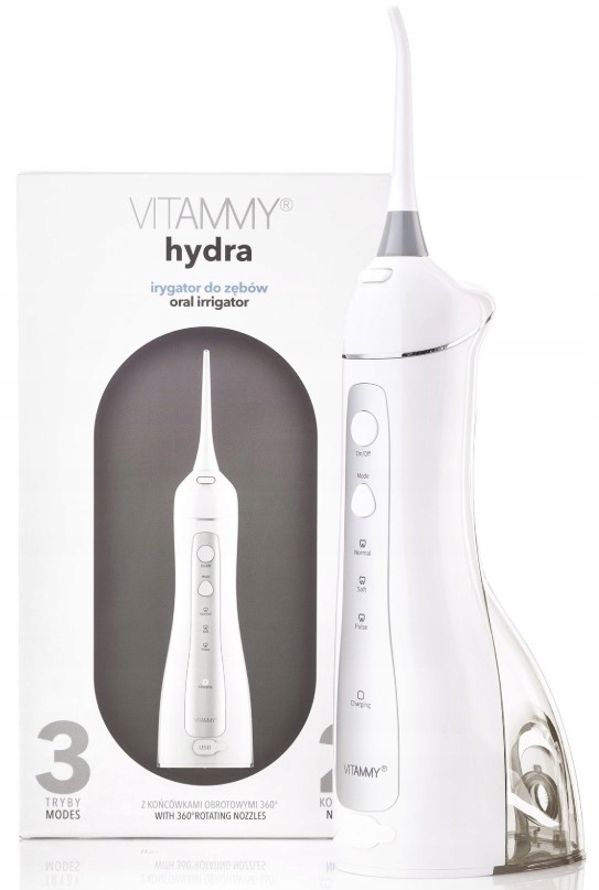 Biało-szary irygator do jamy ustnej Vitammy Hydra z pudełkiem. Pudełko przedstawia irygator i tekst po polsku. Irygator stoi na białej powierzchni.