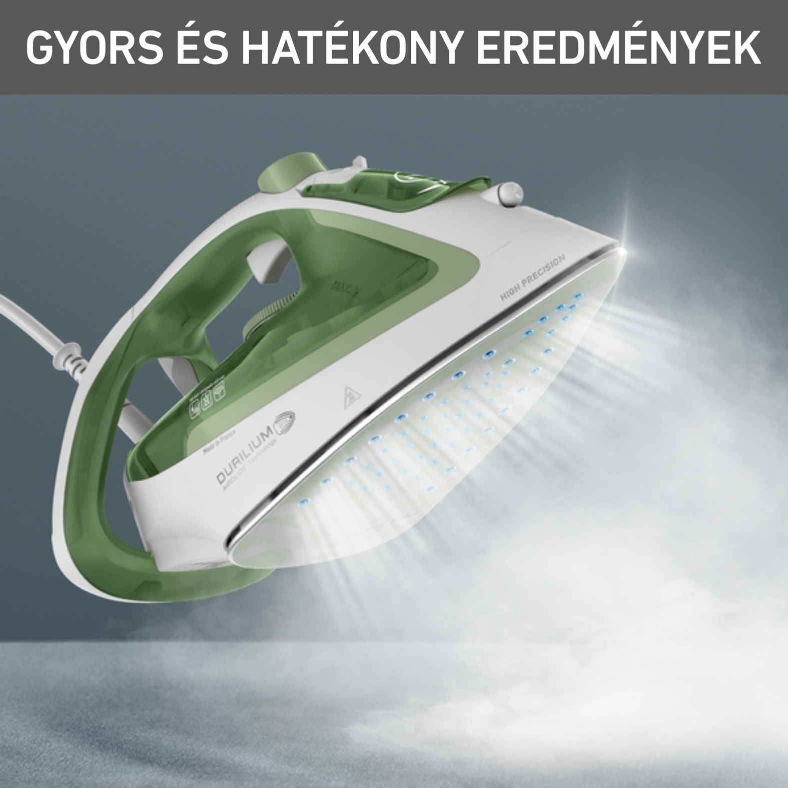 Zöld-fehér vasaló gőzzel. A szöveg 'DURILIUM' és 'HIGH PRECISION'.