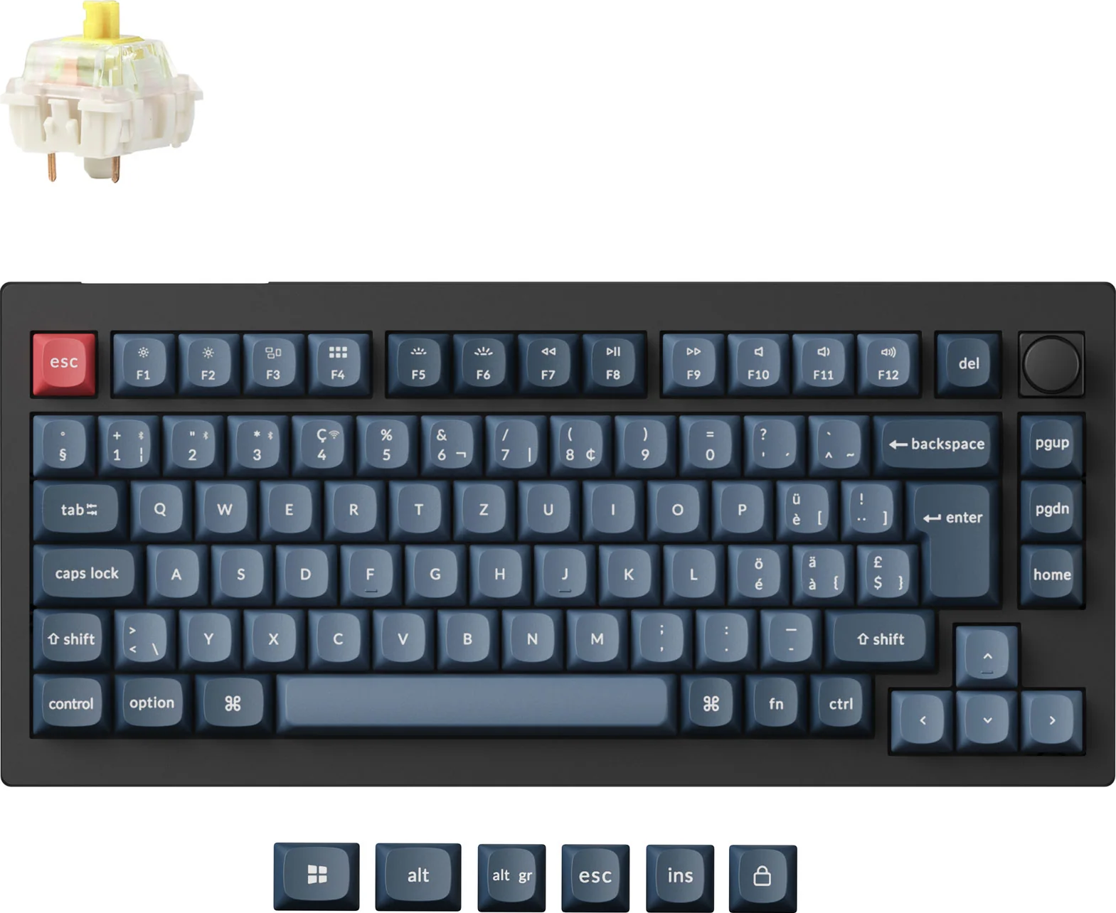Un clavier mécanique avec des touches bleues. Un seul interrupteur est en haut à gauche. Diverses touches de fonction sont présentes.
