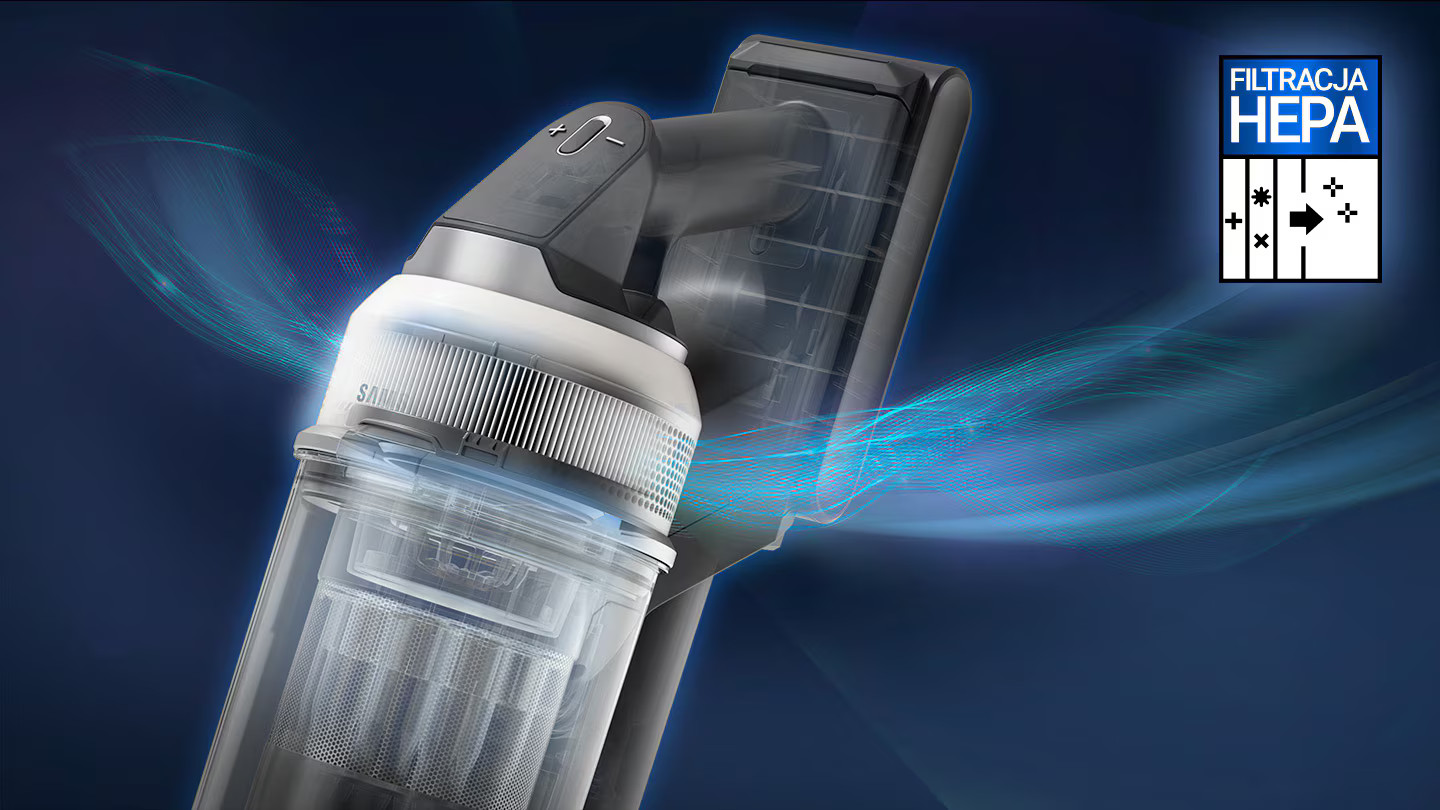 Zbliżenie odkurzacza z przezroczystym pojemnikiem na kurz. Filtr oznaczony HEPA. Niebieskie linie sugerują przepływ powietrza.